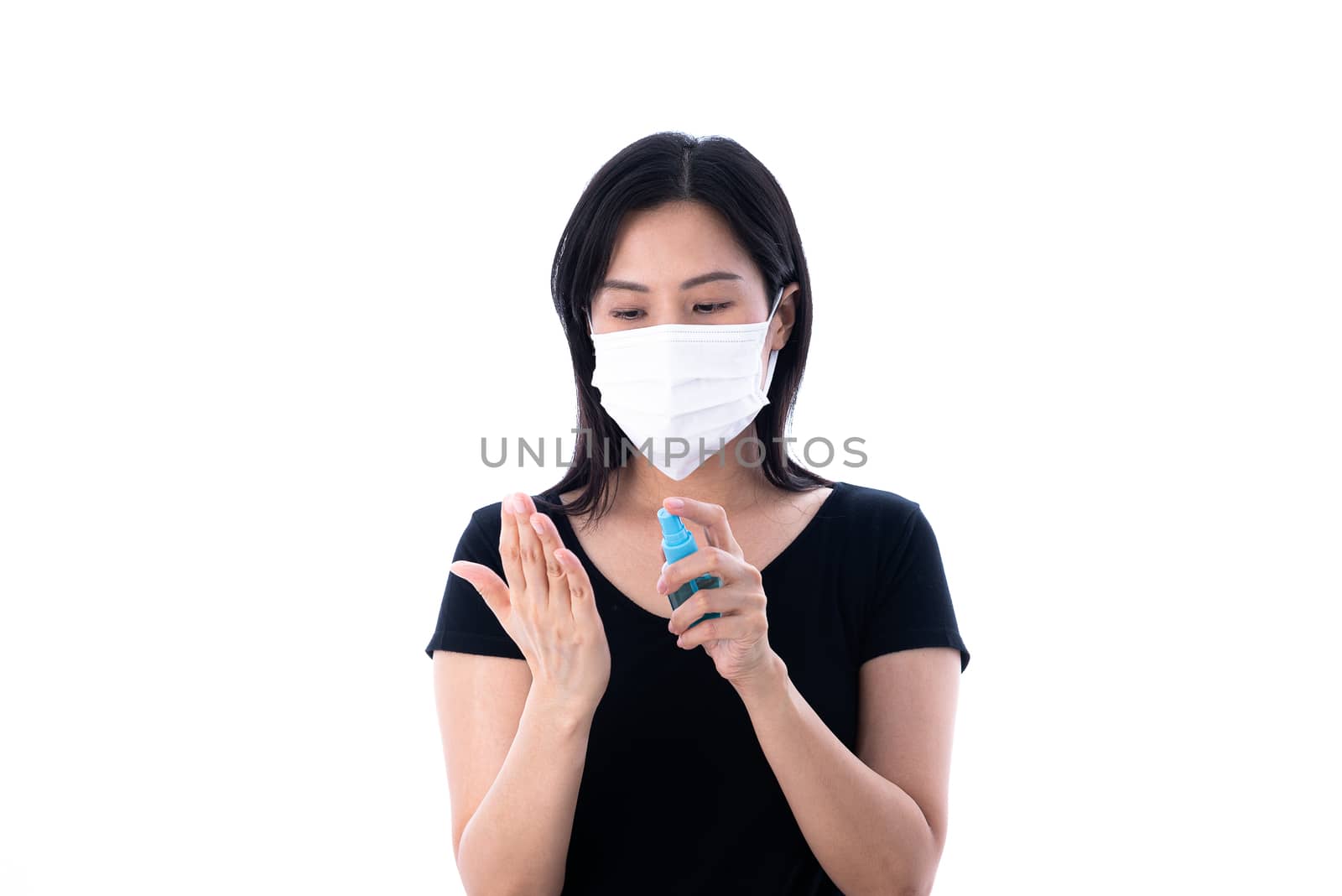 A beautiful Asian Thai woman wearing a white mask and does cleaning hand with cleaner gel to protect COVID-19 isolated on white background.