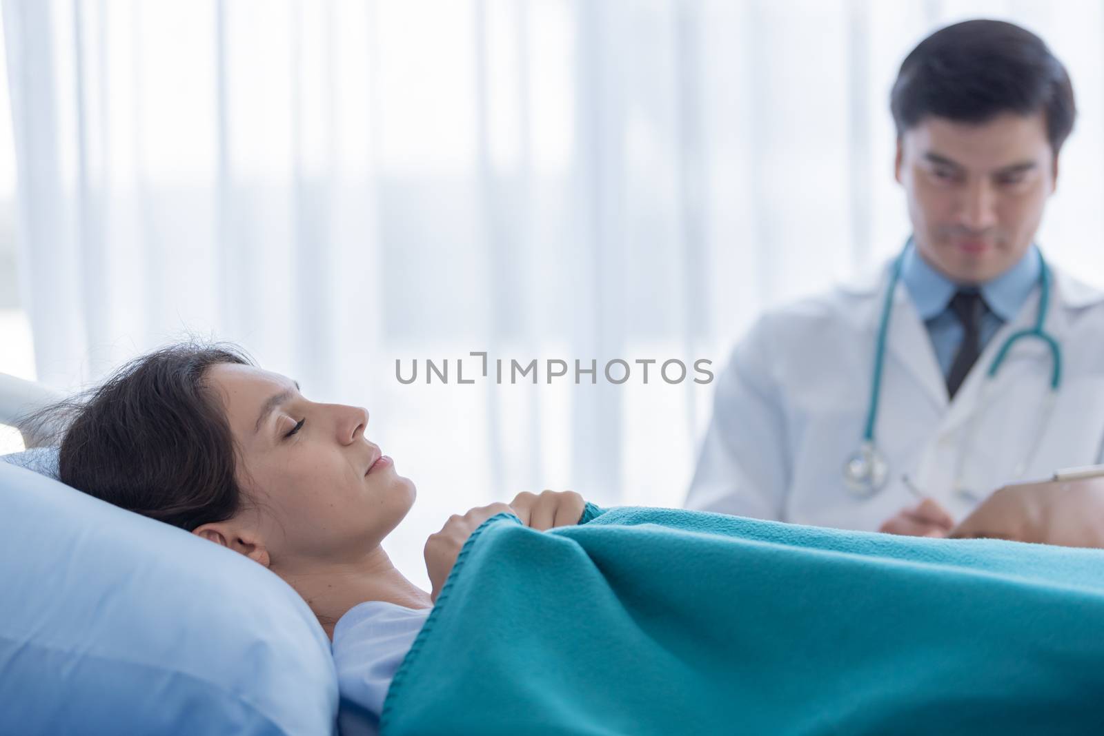A doctor take care of sick patient woman at the hospital or medi by animagesdesign