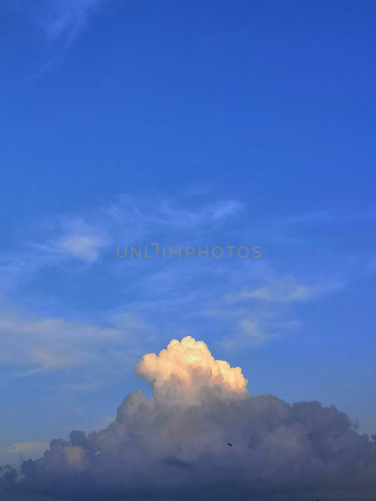 The end of the cloud that has the sunlight