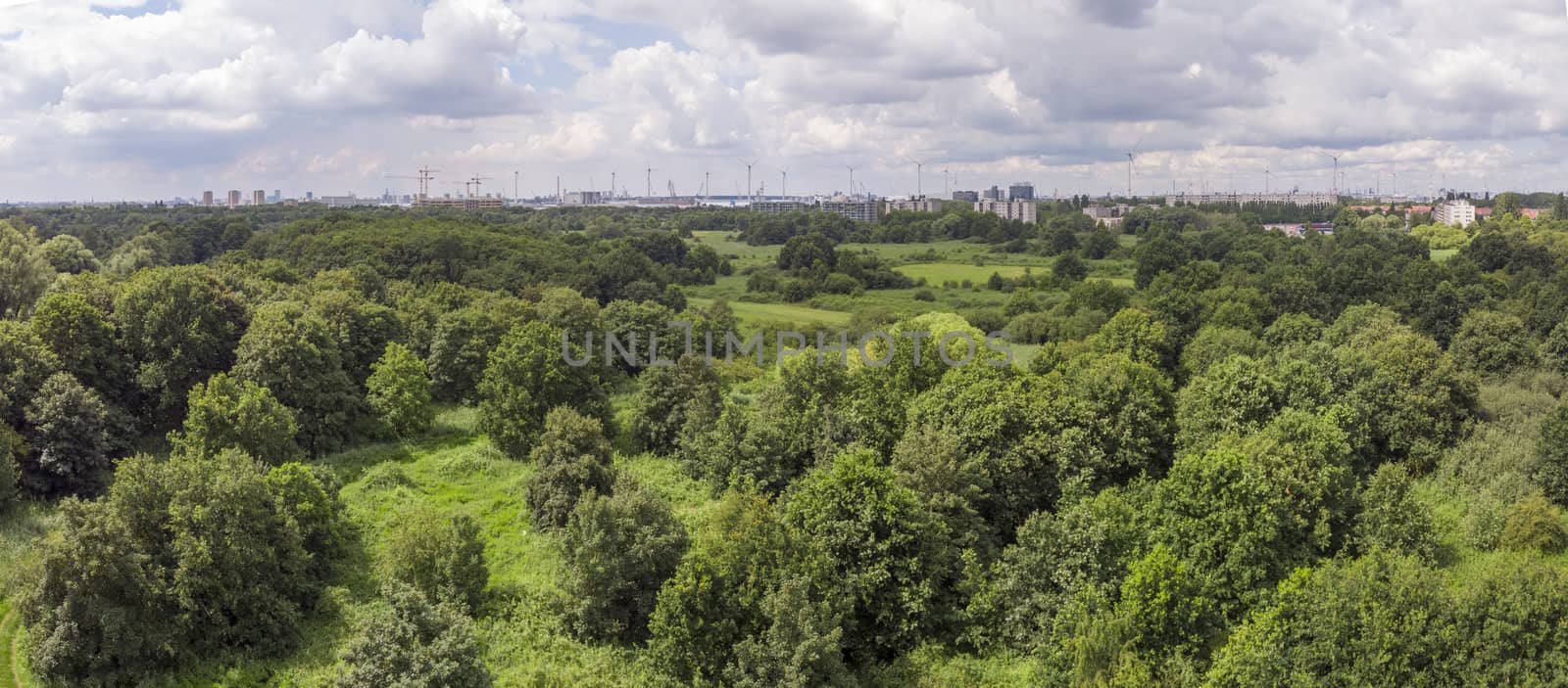 aerial panorama over Oude Landen nature park in Ekeren, with village and harbor in the distance. Travel and tourism