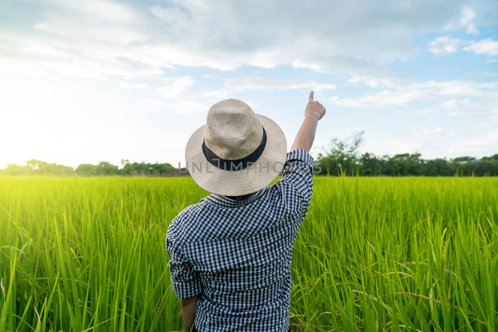 rural woman pointing to the sky by somesense