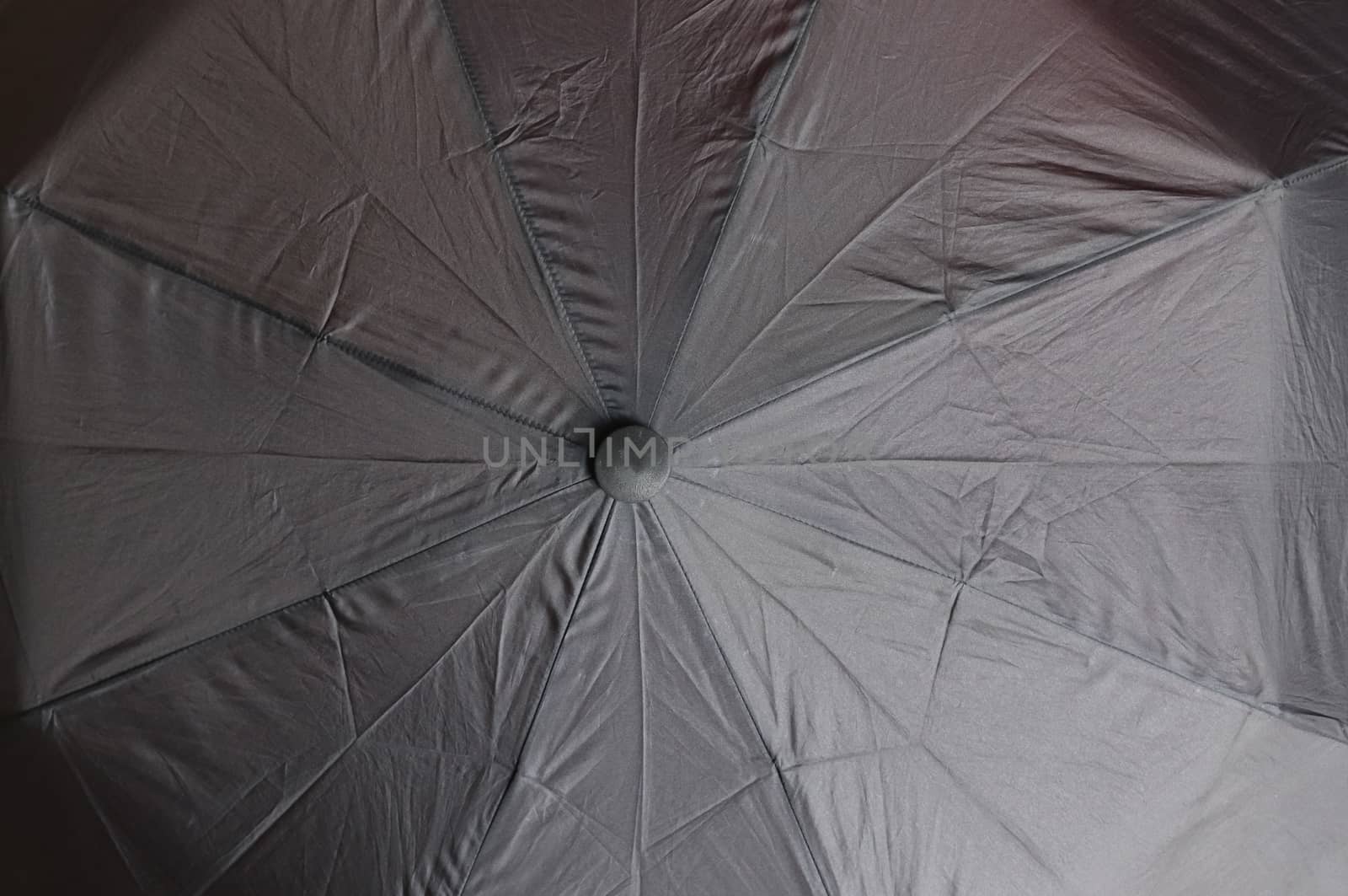 Close up view at the colorful surface of a rainproof umbrella