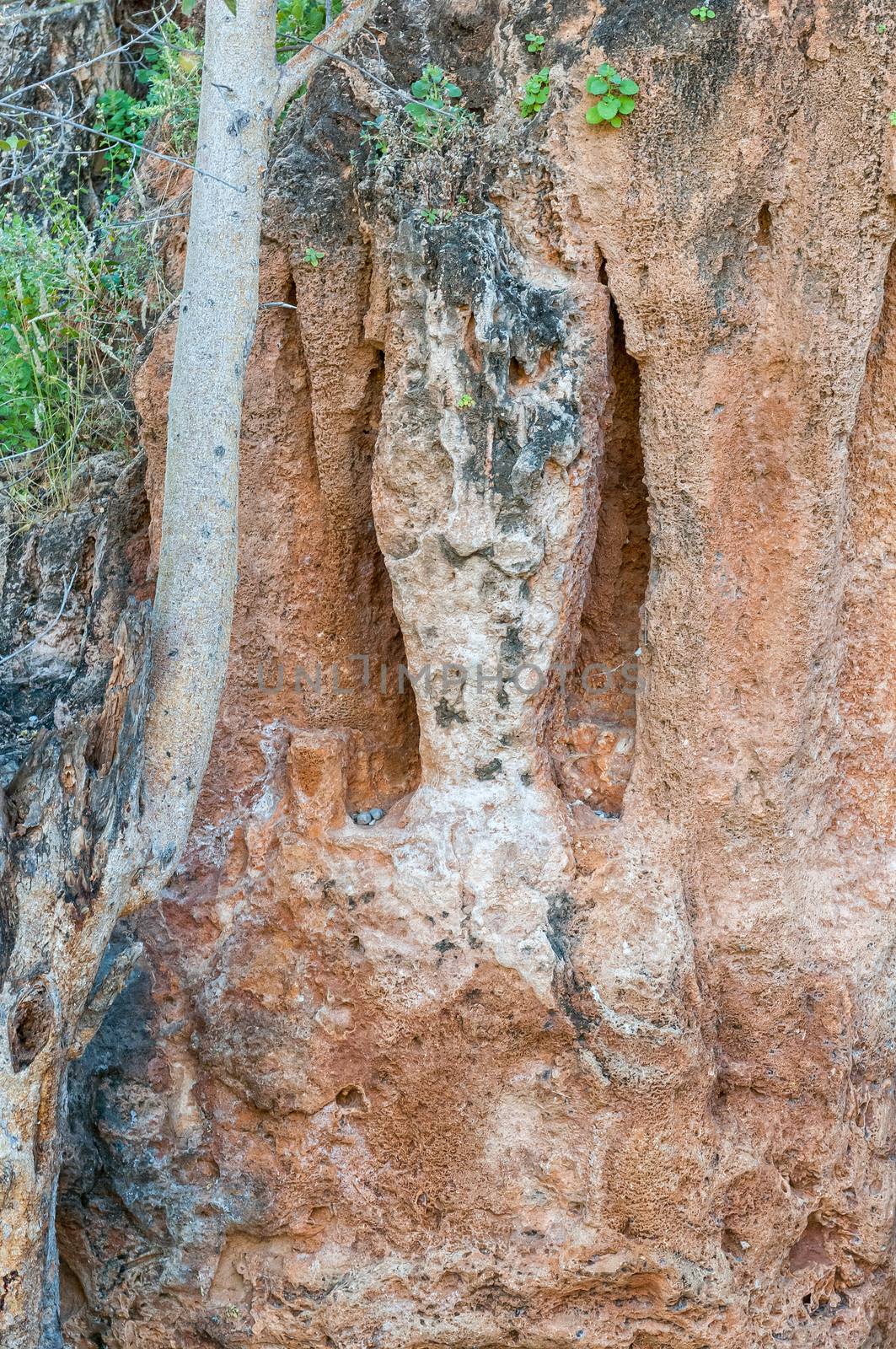 A stalactite and stalagmite pillar of a collapsed cave at the Ongongo camping site in the Kaokoveld region of Namibia