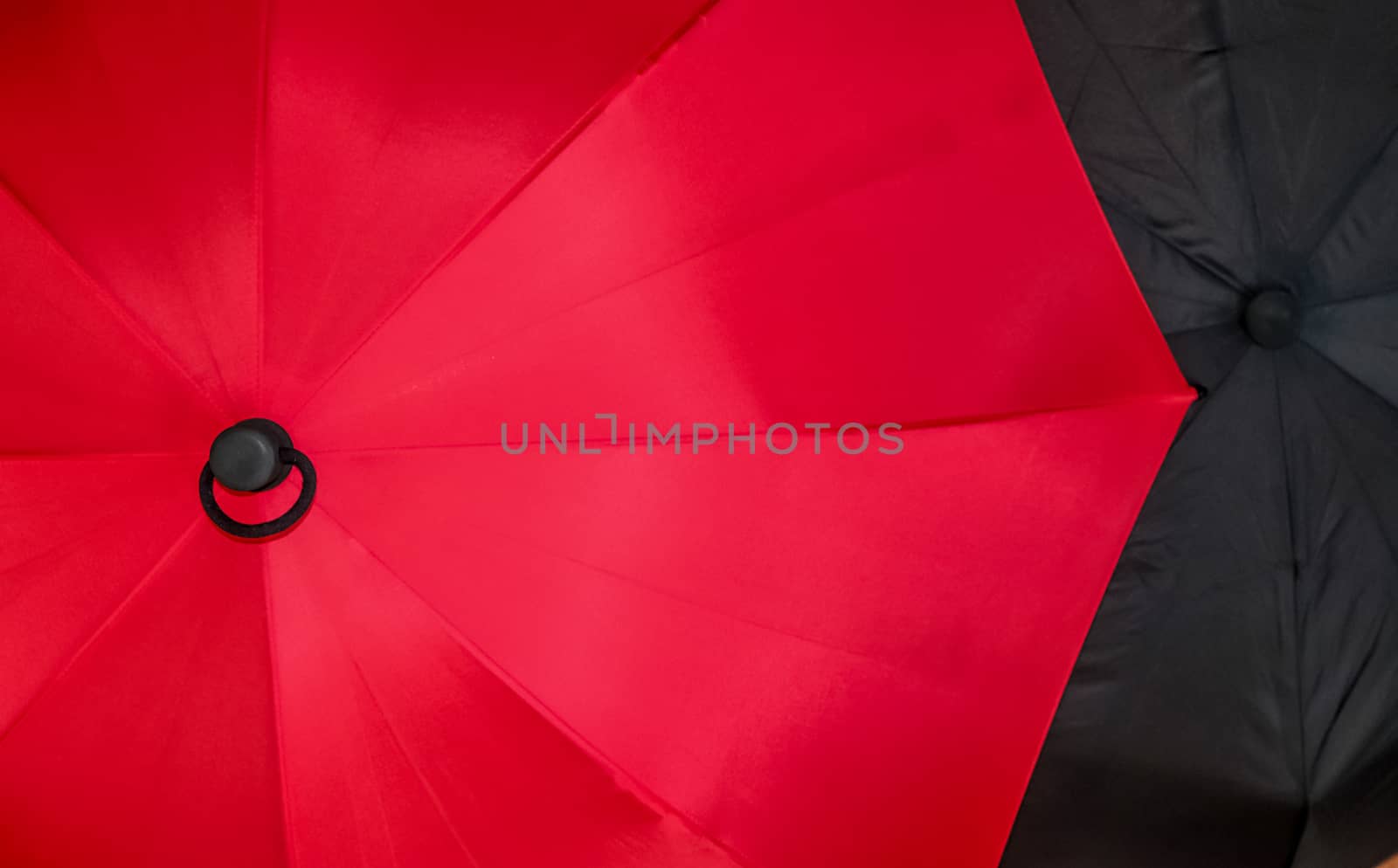 Close up view at the colorful surface of a rainproof umbrella