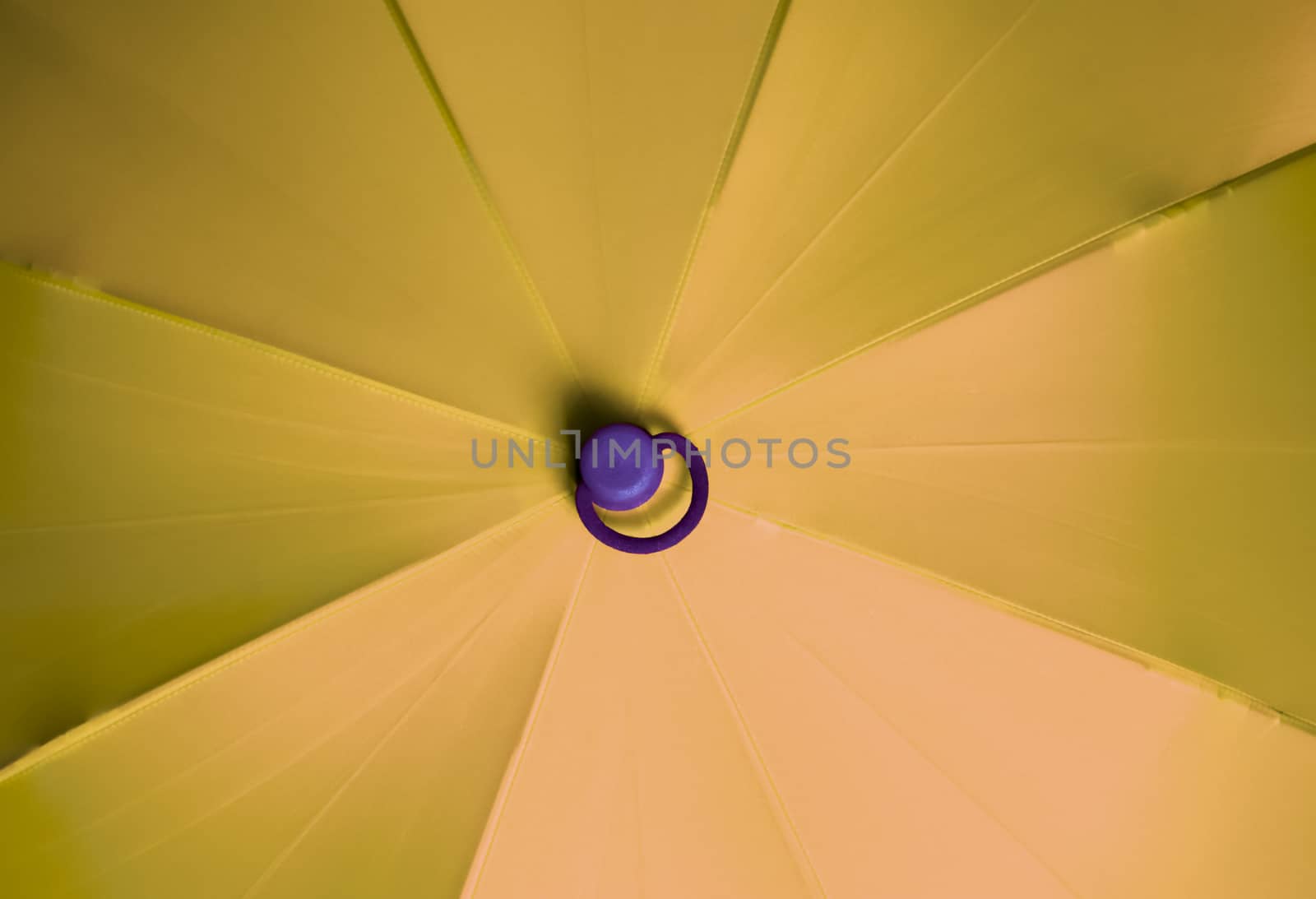 Close up view at the colorful surface of a rainproof umbrella