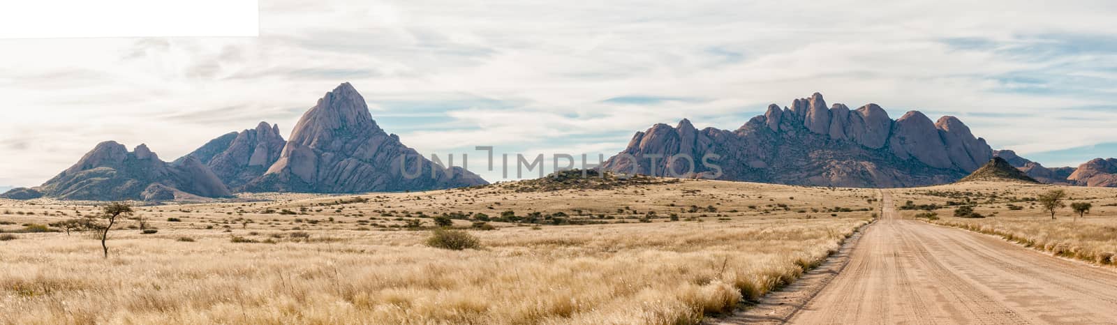 Panorama of Spitzkoppe and Pondok mountains seen from road D3716 by dpreezg