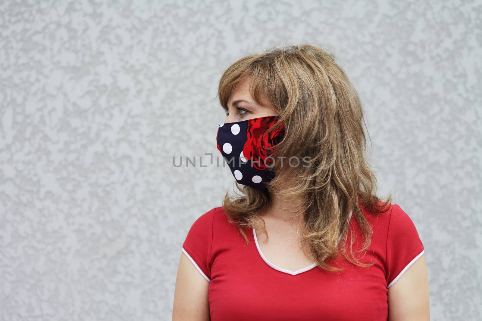 Girl in a protective mask against coronavirus by selinsmo