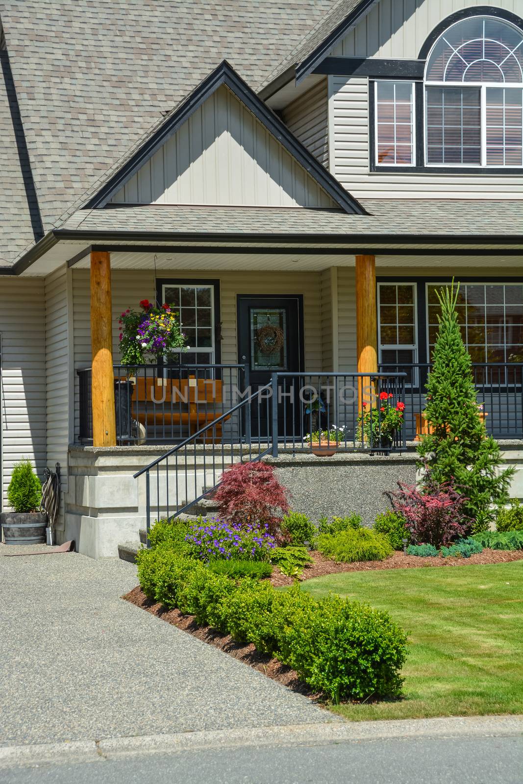 Entrance of suburban house with landscaping in front