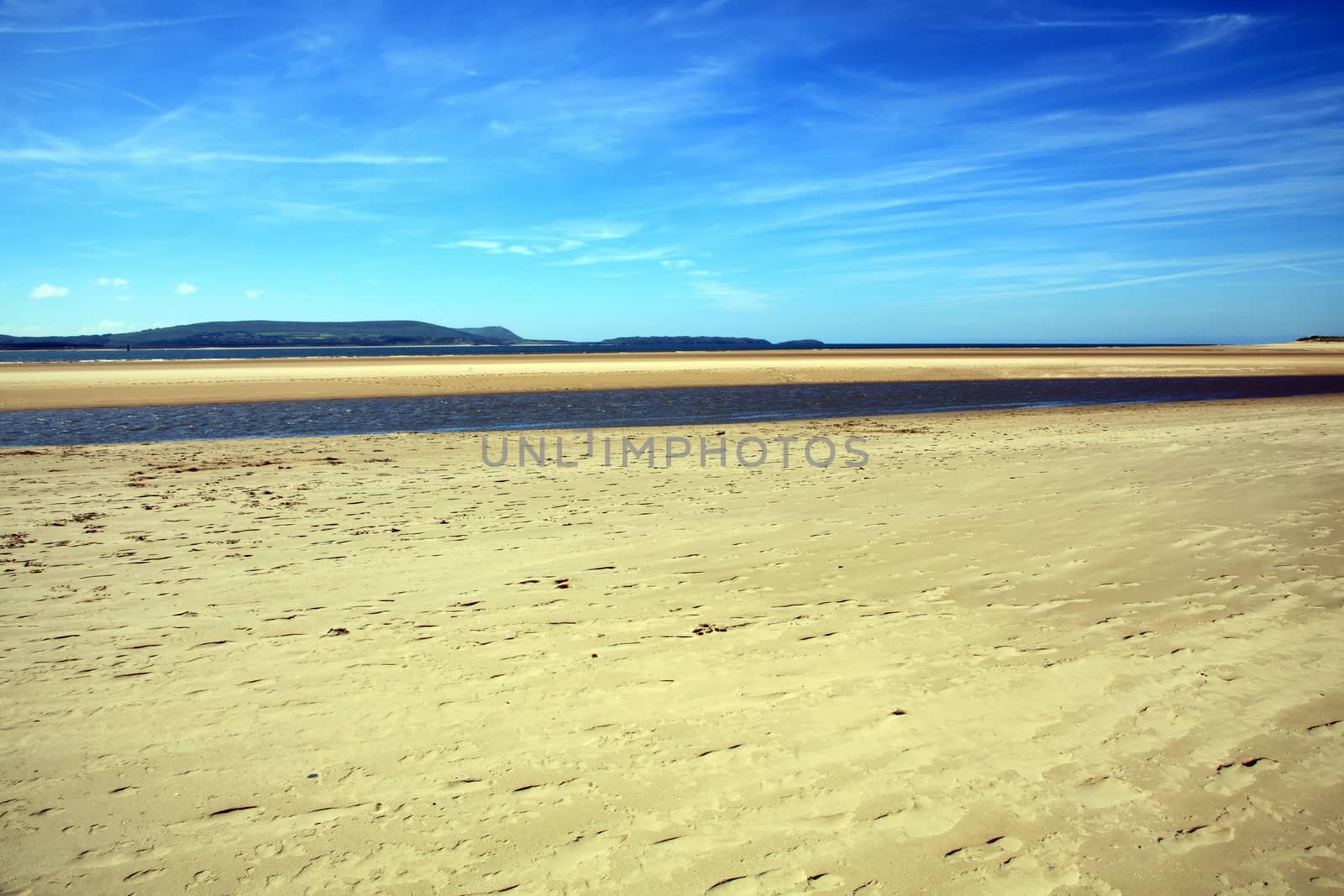 Coastline background of the sand beach at the coast of Burry Port Carmarthenshire Wales UK