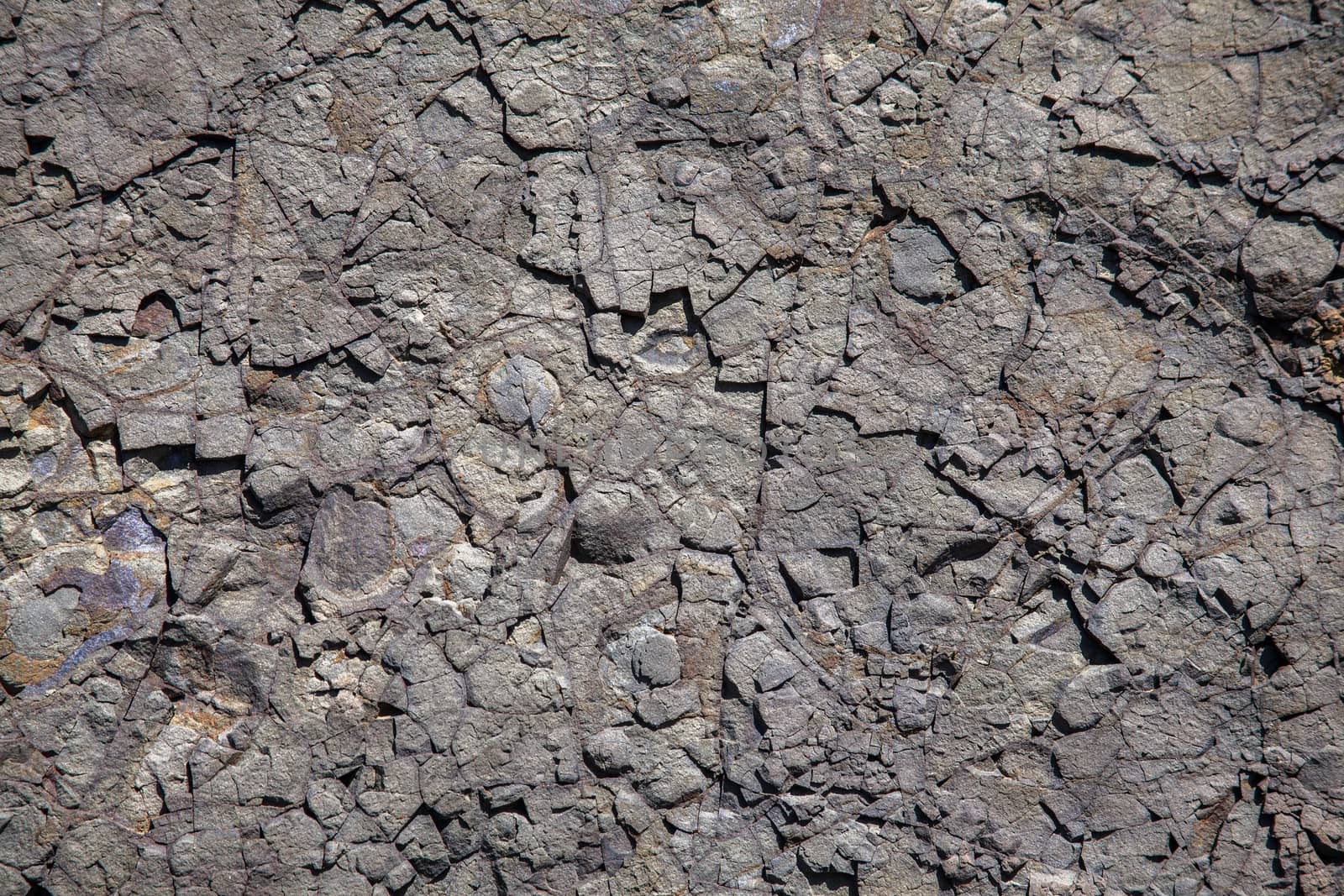 Volcanic weathered stone rock close up texture background 