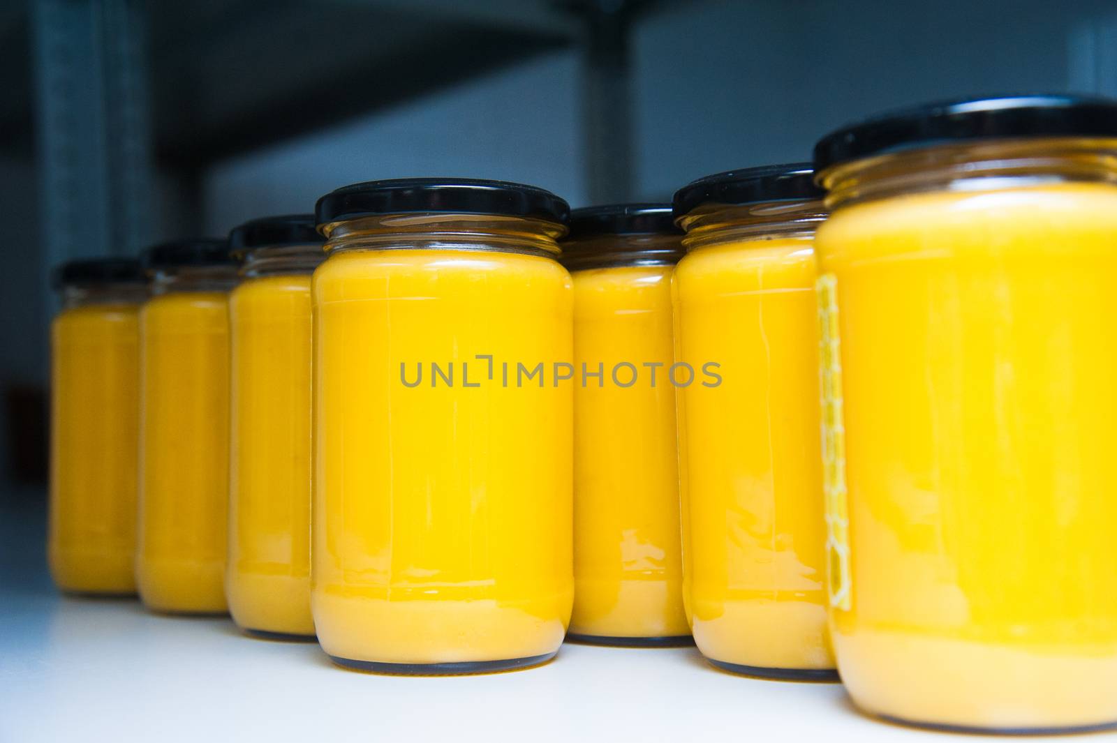 Jars full of organic honey. Production in factory