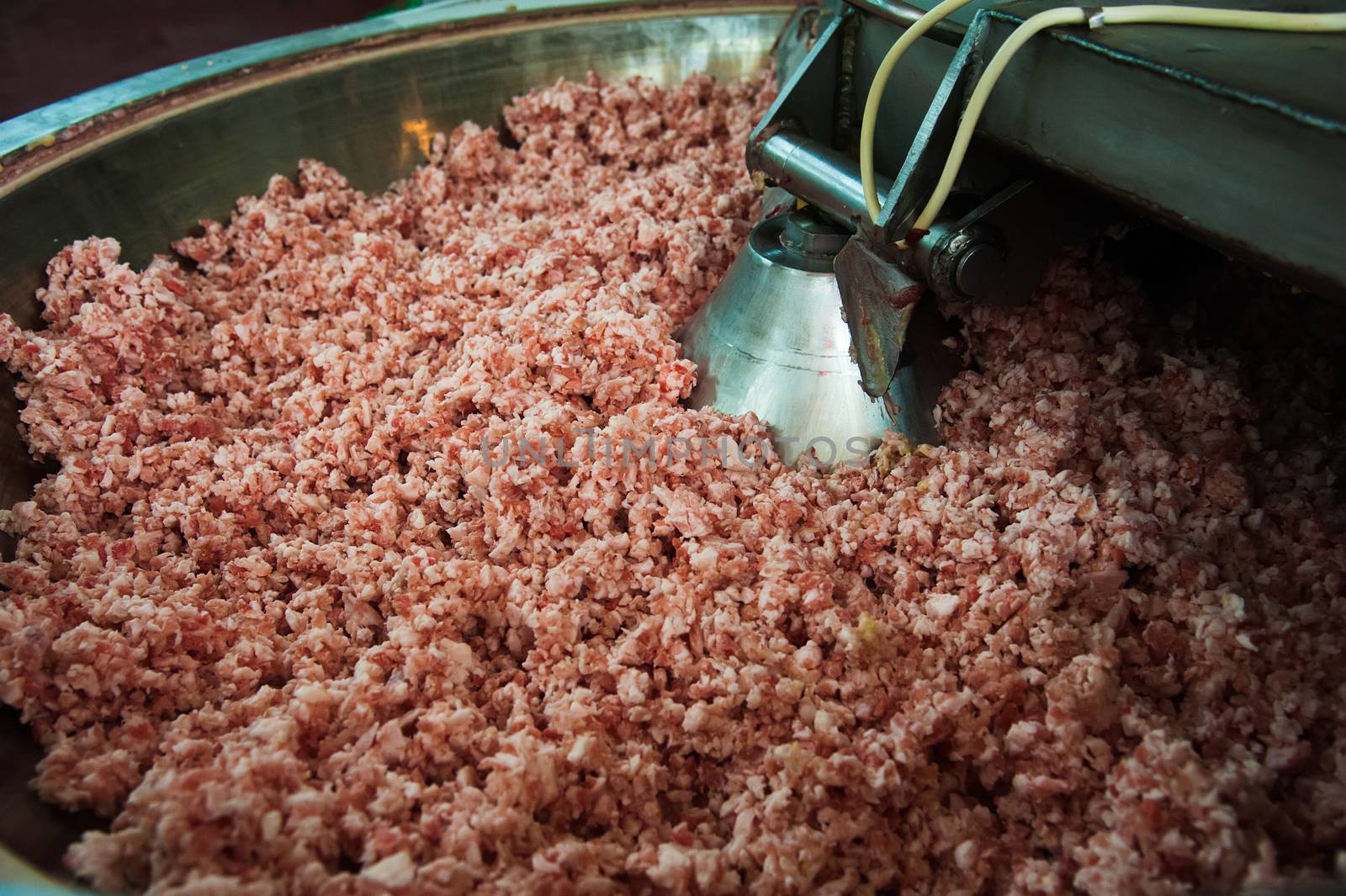 Mixing ingredients for sausages on a production line by grigorenko