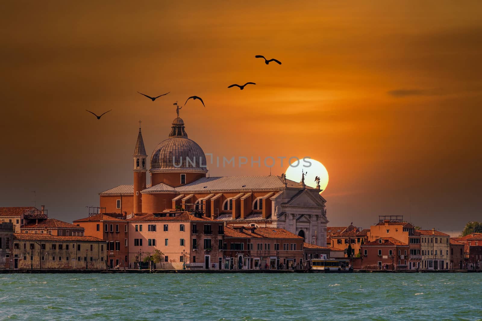 Dome of Venice Church Beyond Old Brick Buildings