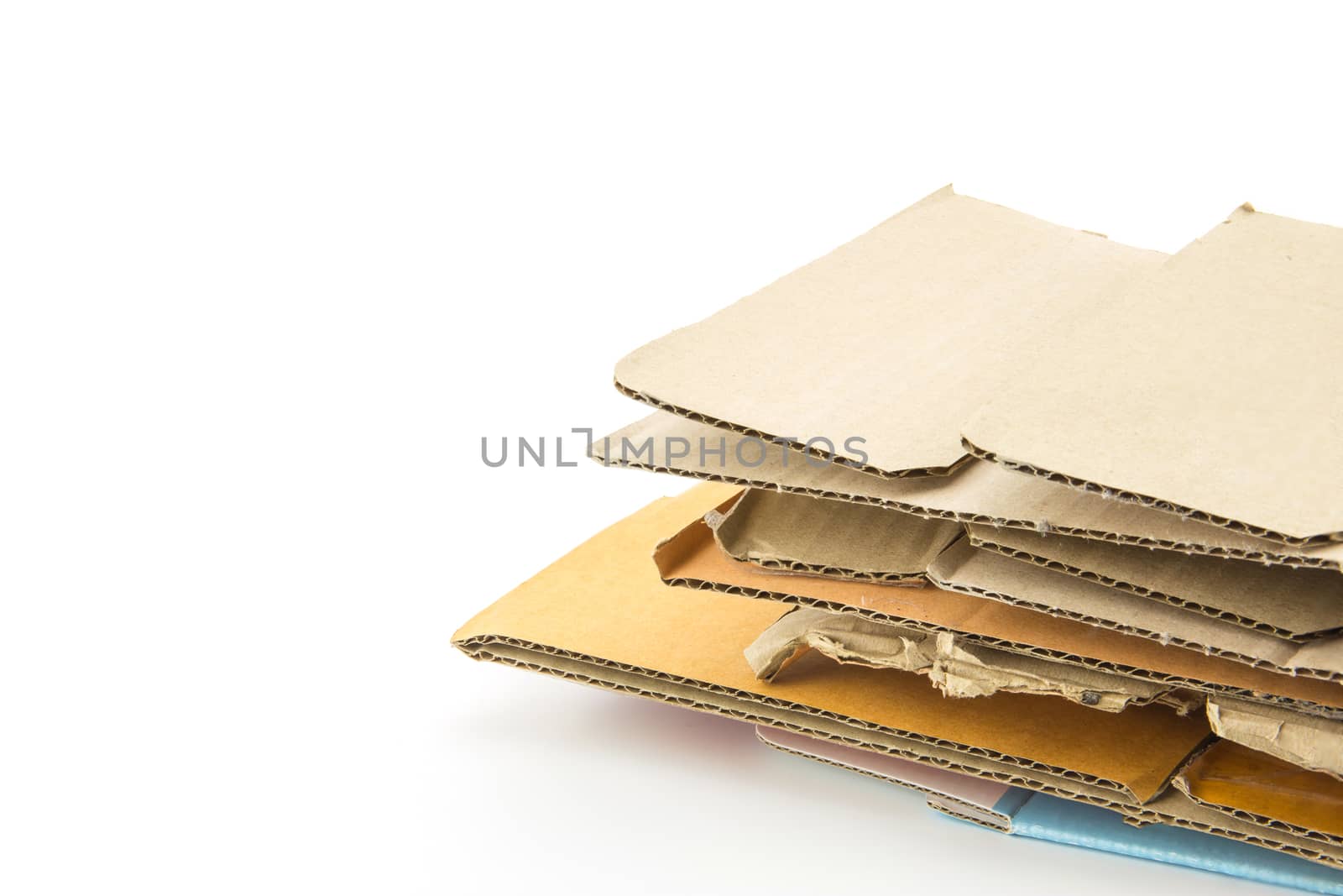 Big stack of cardboard isolated on white background - recycle concept.