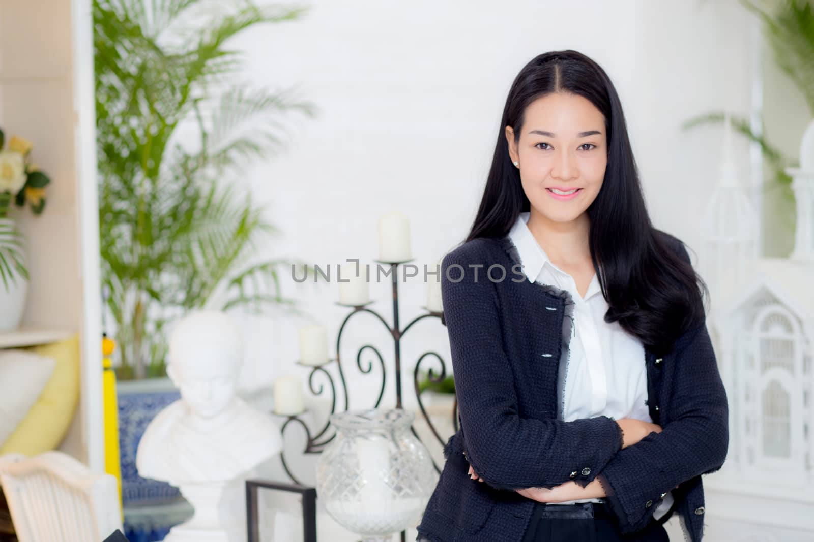 business woman in the office looking happy and smiling.