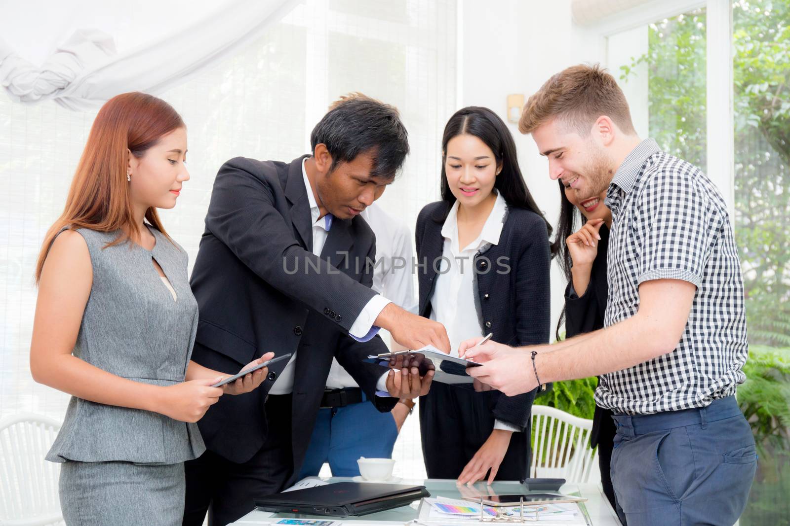 businessman signing a document in the office at meeting room. by nnudoo