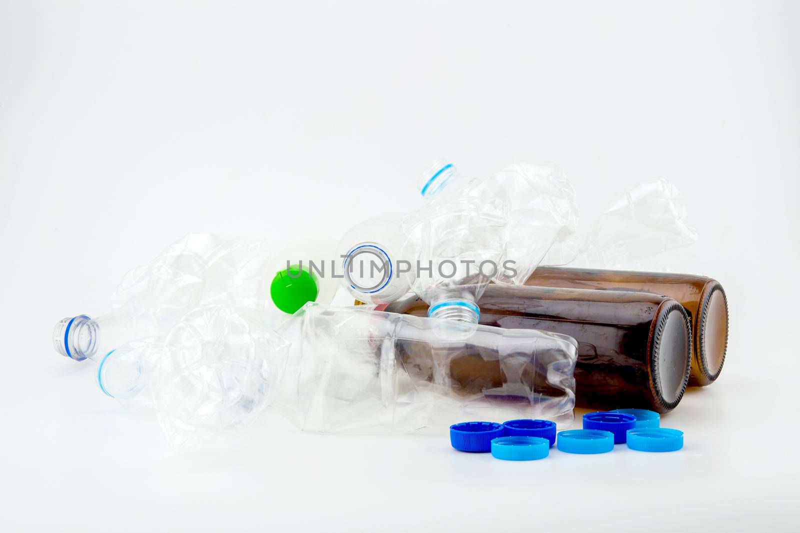 Heap of plastic garbage on white background.
