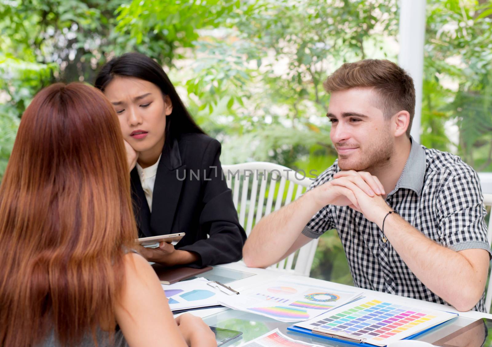 Group of business people brainstorming together in the meeting room.