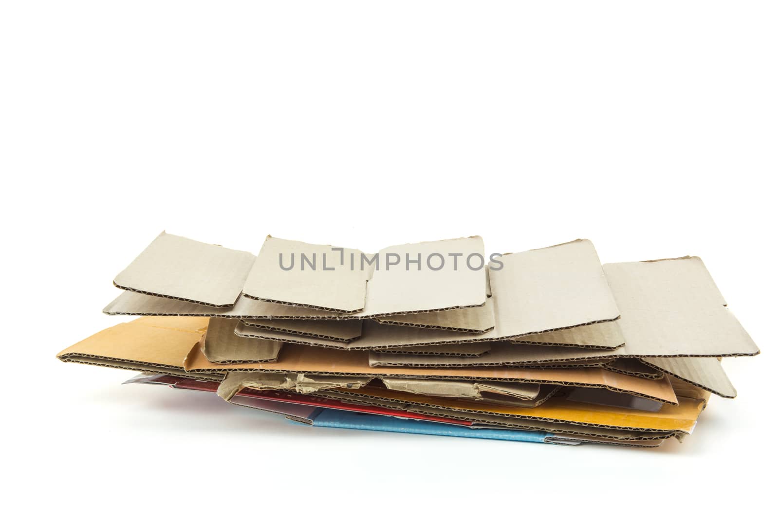 Big stack of cardboard isolated on white background - recycle concept.