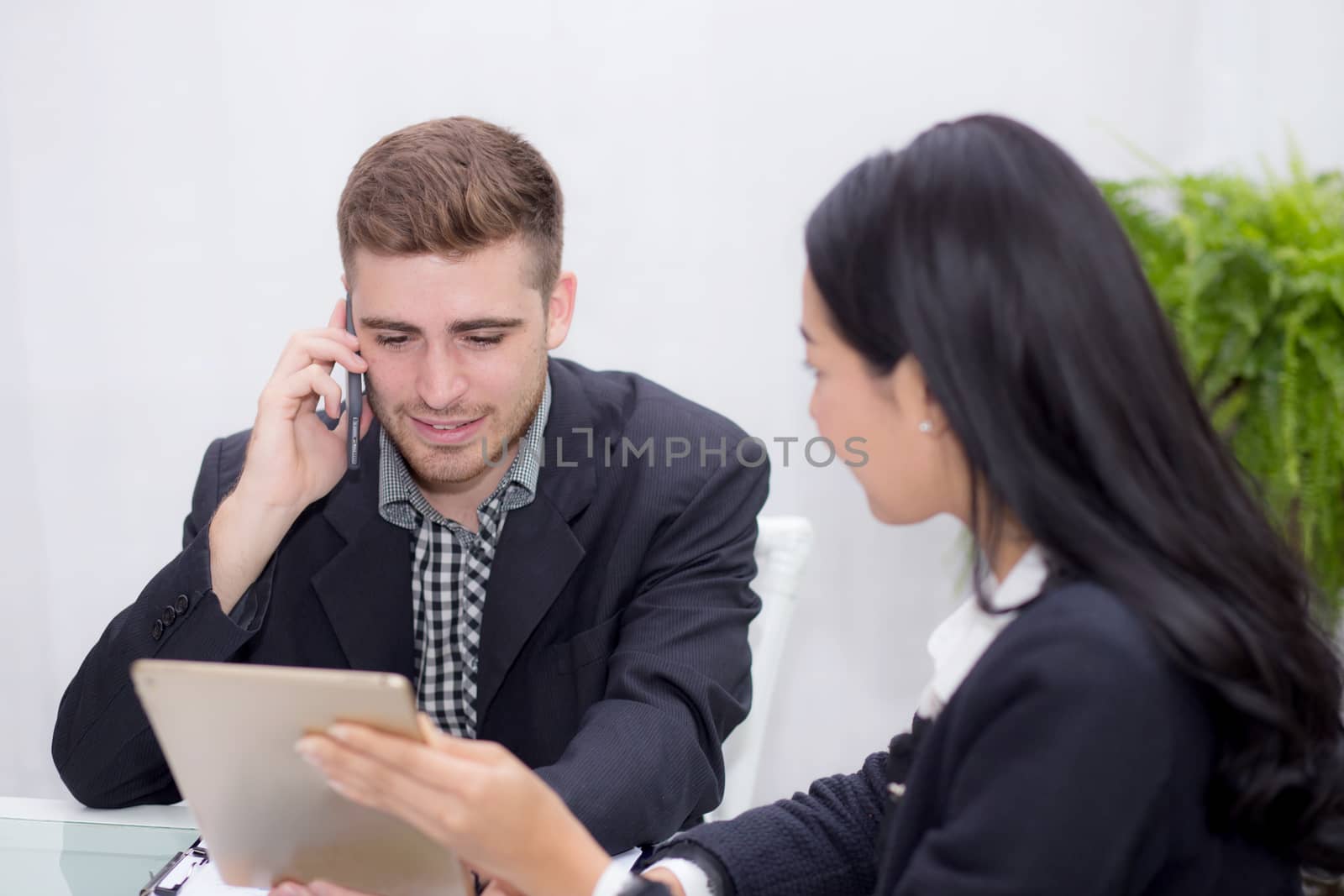 business man and woman people making meeting and looking at tabl by nnudoo