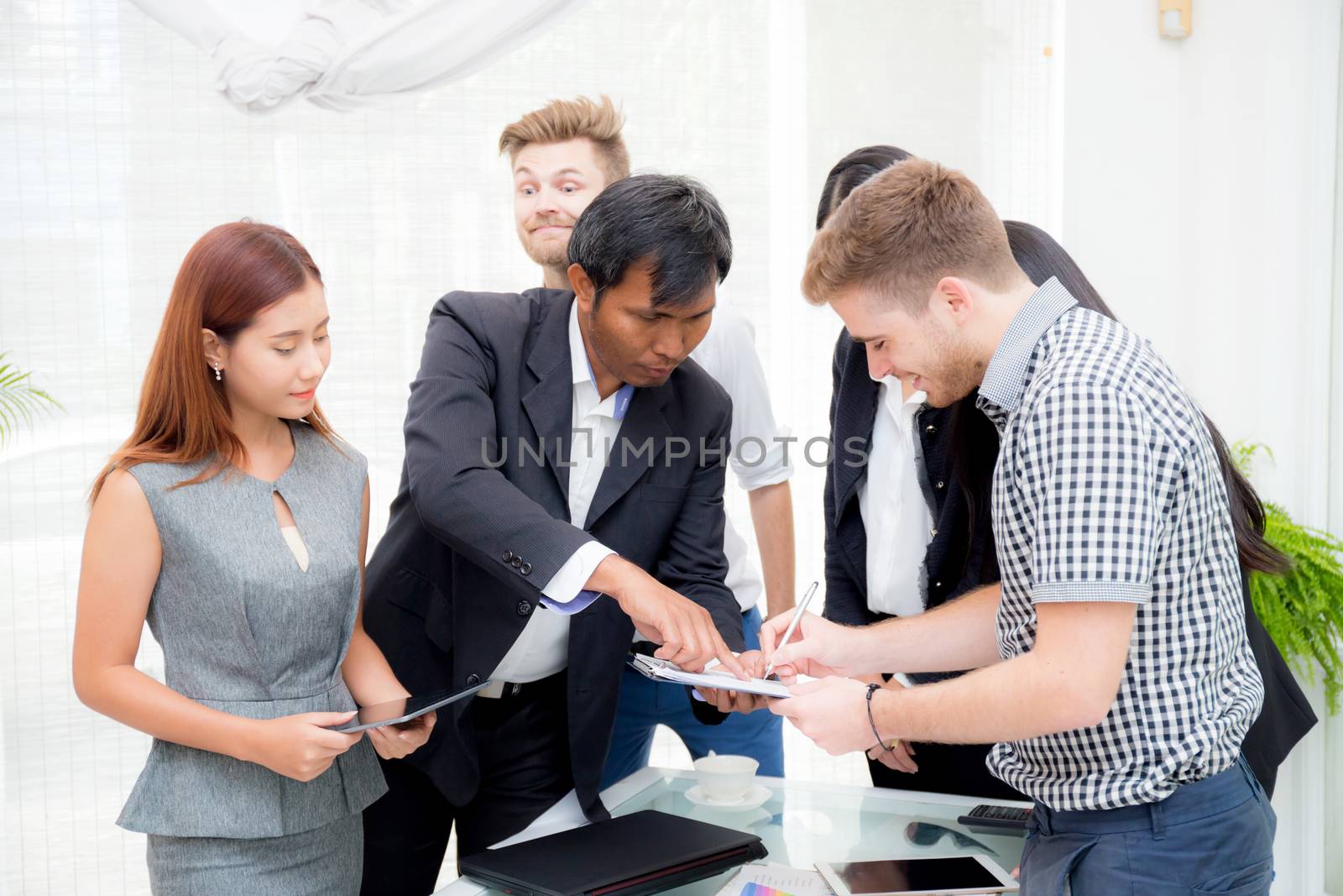 businessman signing a document in the office at meeting room.