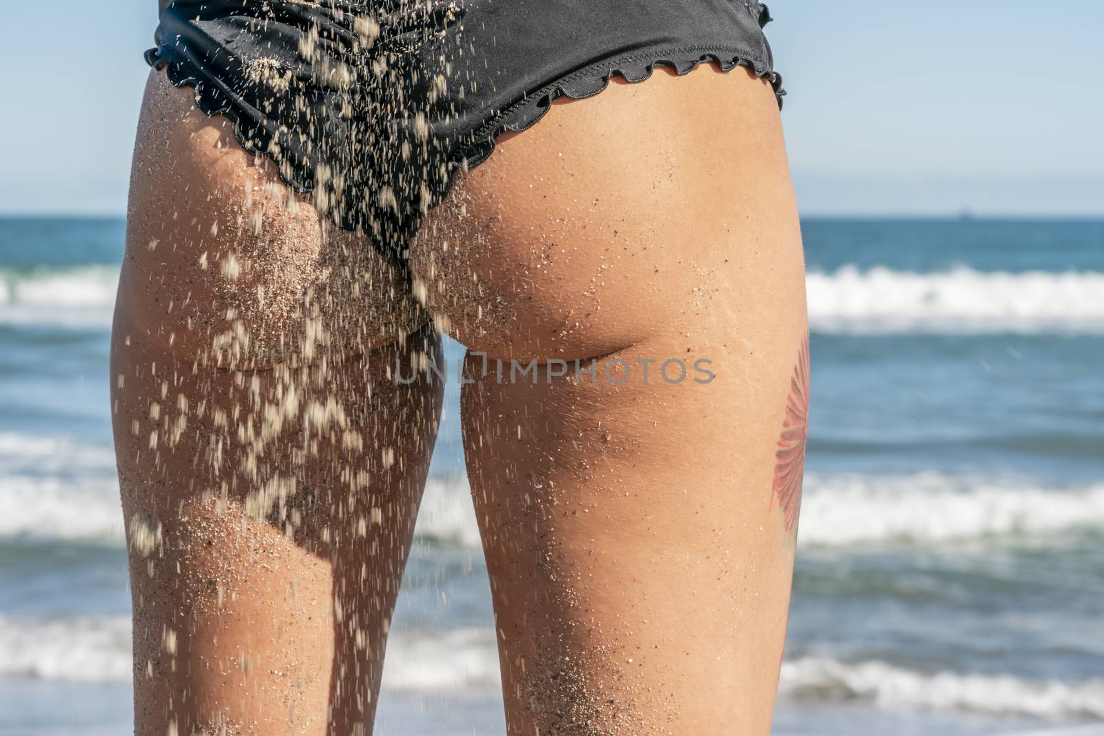 A gorgeous bikini model posing in a beach environment