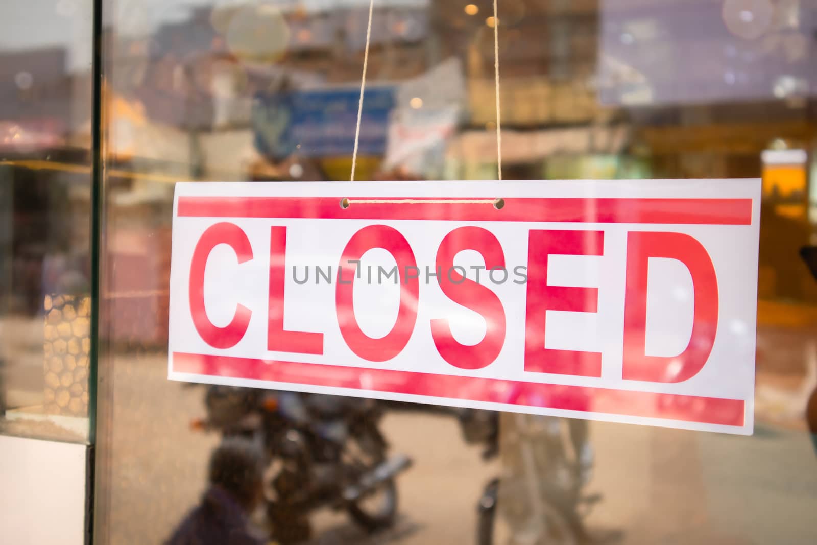 Closed Signage board in front of Businesses or store door due covid-19 or coronavirus outbreak - Concept of business closed due lockdown. by lakshmiprasad.maski@gmai.com