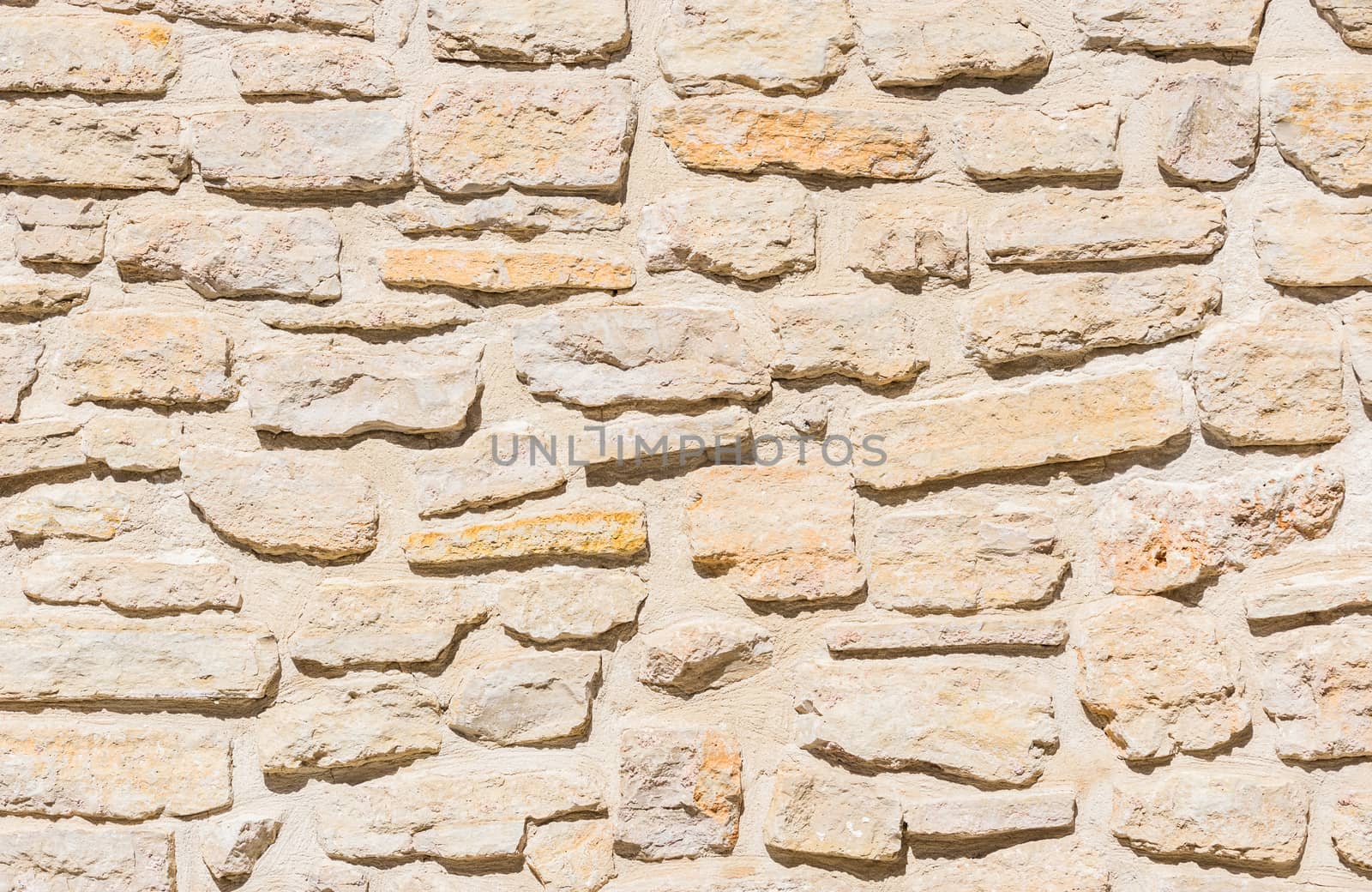 Rustic old stone wall texture background structure