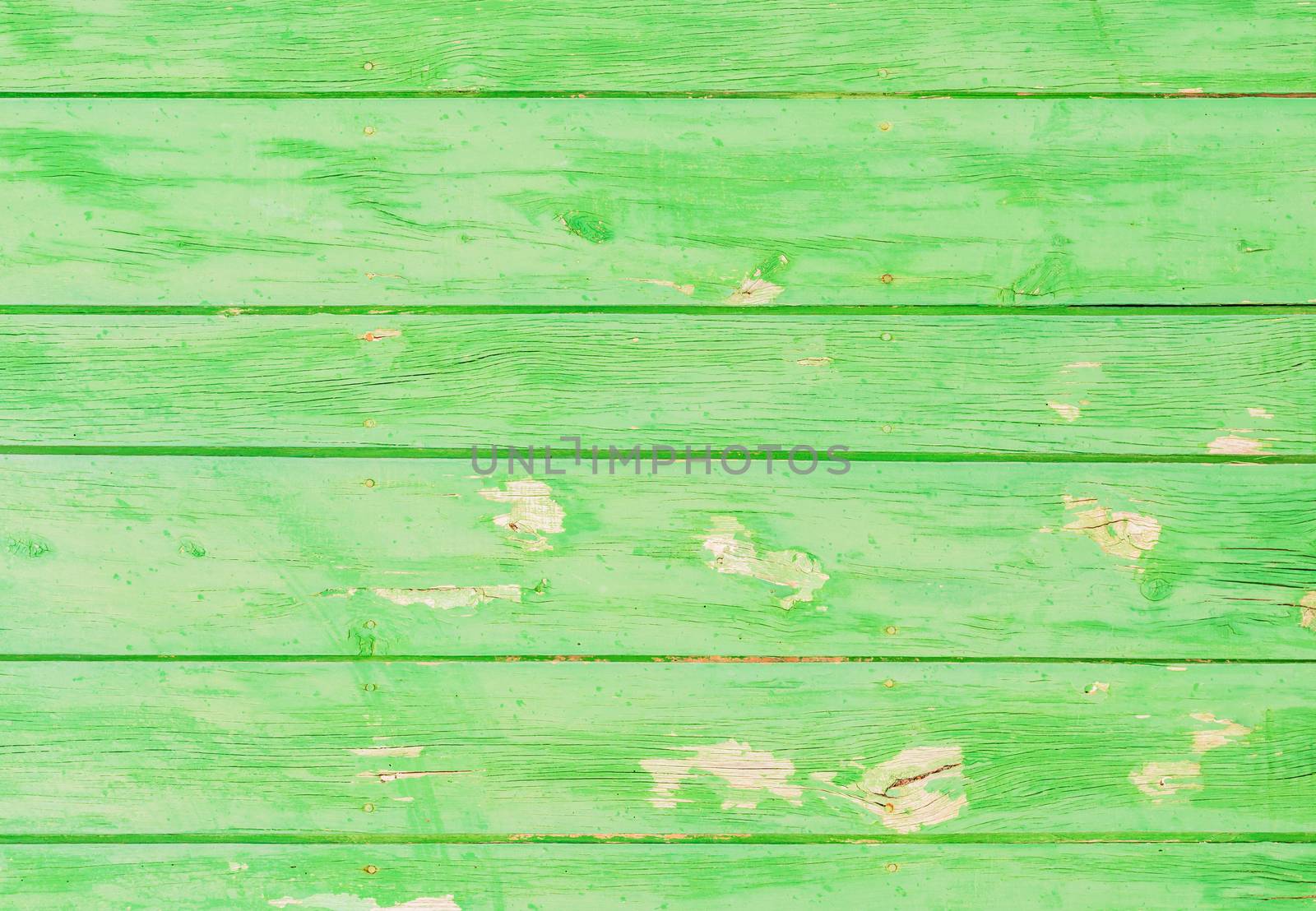Rustic green colored wooden planks background texture with copy space