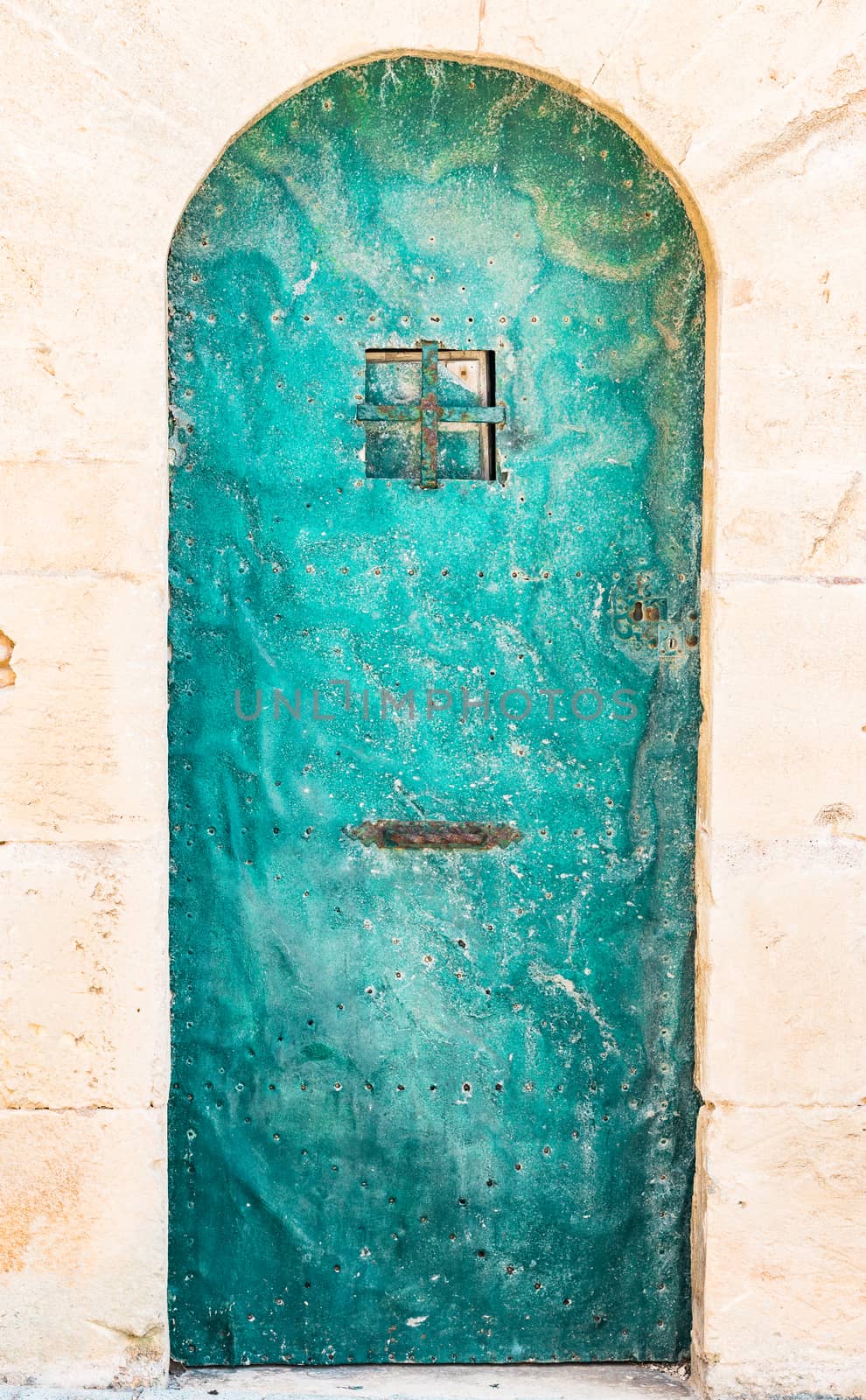 Detail view of ancient metal door, closed