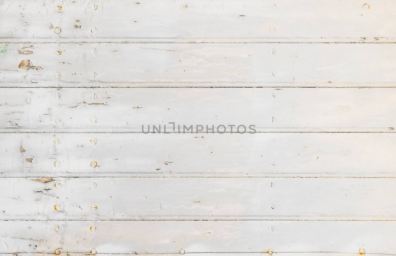 Old white painted wooden planks for background texture