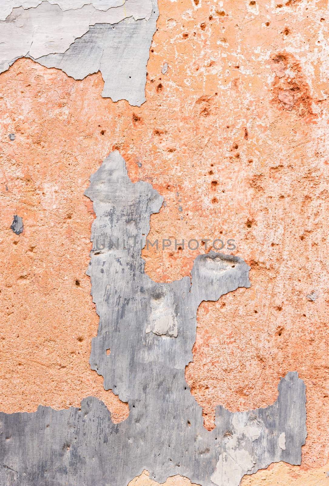 Close-up of peeling plaster wall background texture