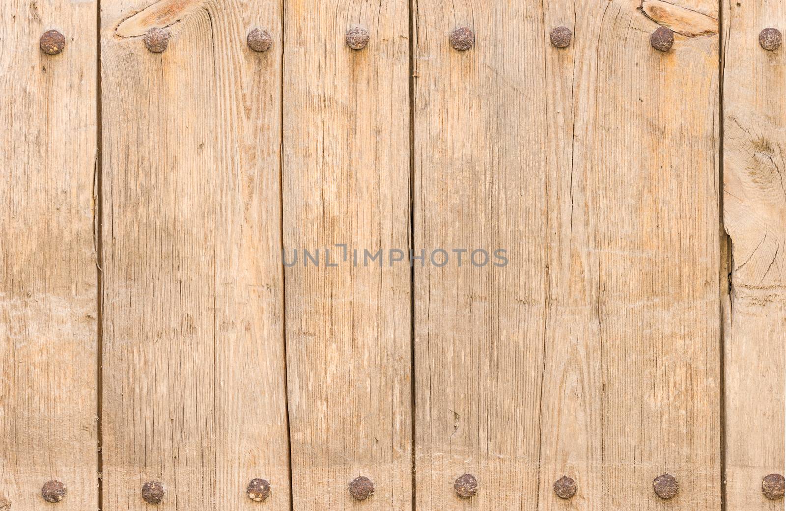 Old wooden boards backdrop texture, framed with rusty nails