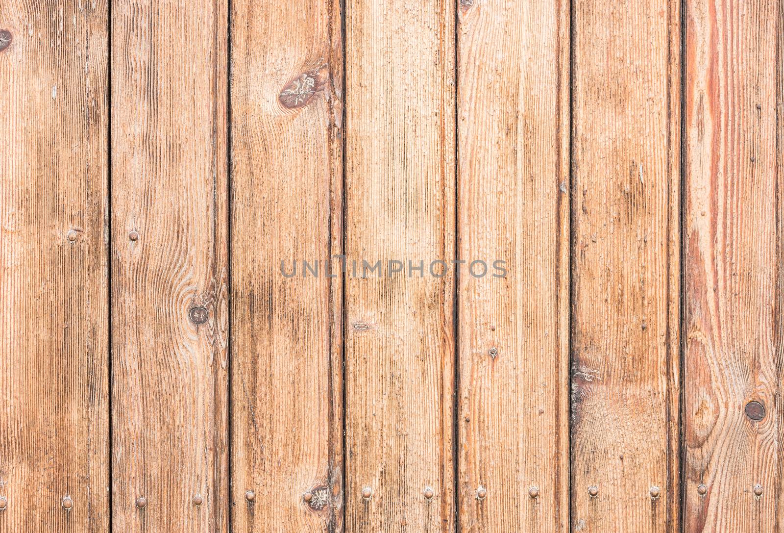 Rustic wooden wall planks background texture, close-up