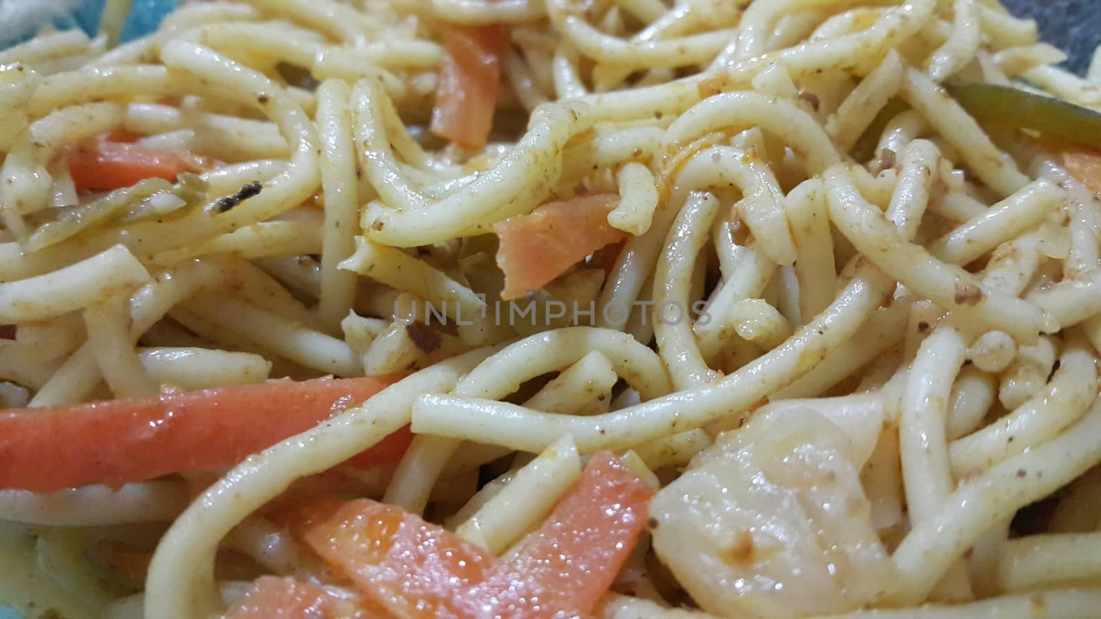 close up view of swirling noodles or spaghetti pasta in a bowl