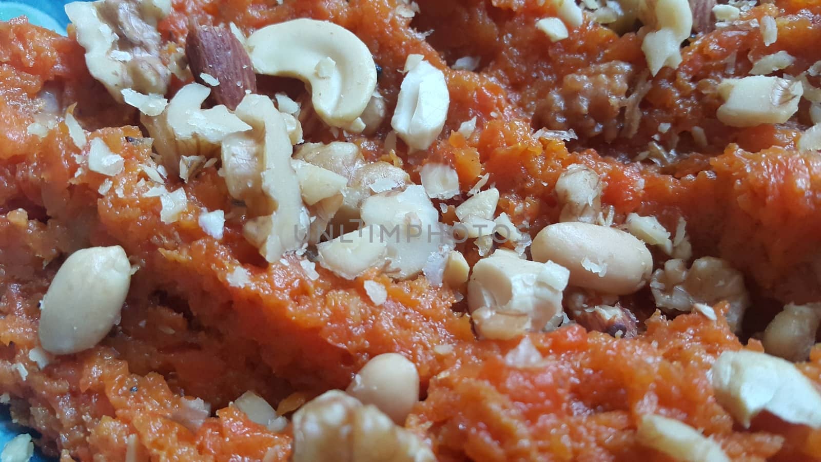 Closeup view of traditional  tasty sweet dessert called Suji Halwa or Halva, made of Semolina at home in south Asian countries with different dry fruit ingredients