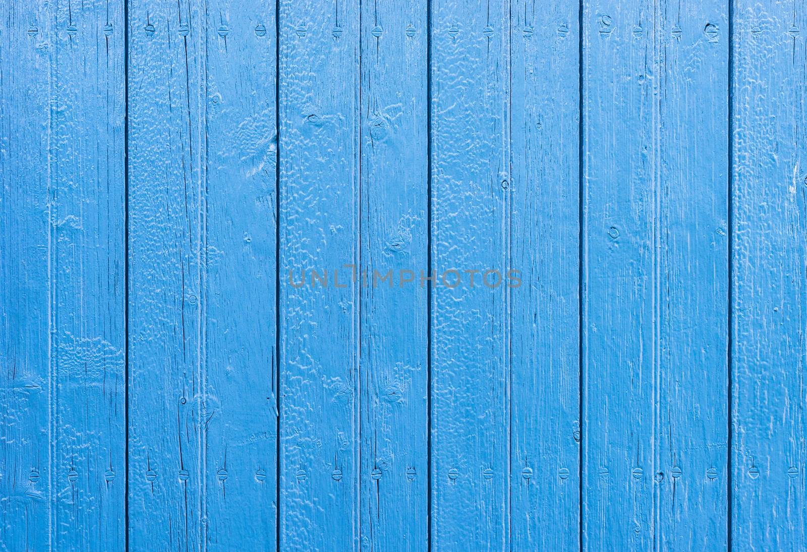 Blue colored wooden planks background texture with copy space