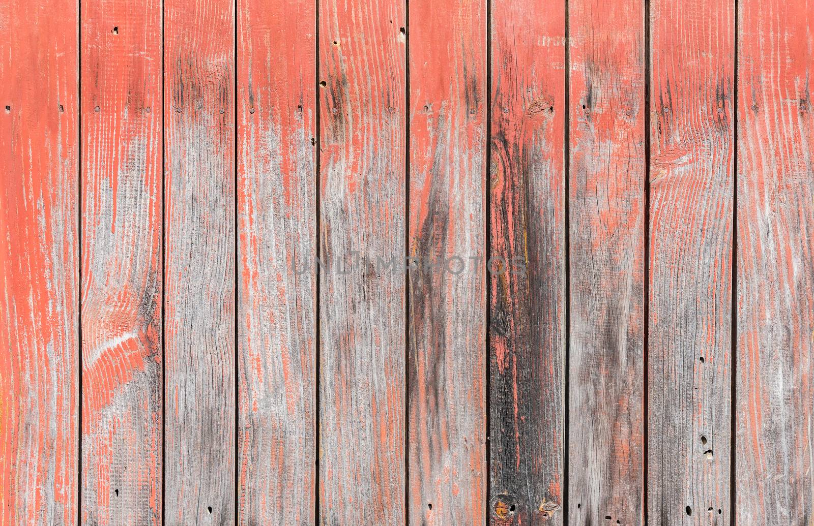 Old weathered red painted wooden planks background texture