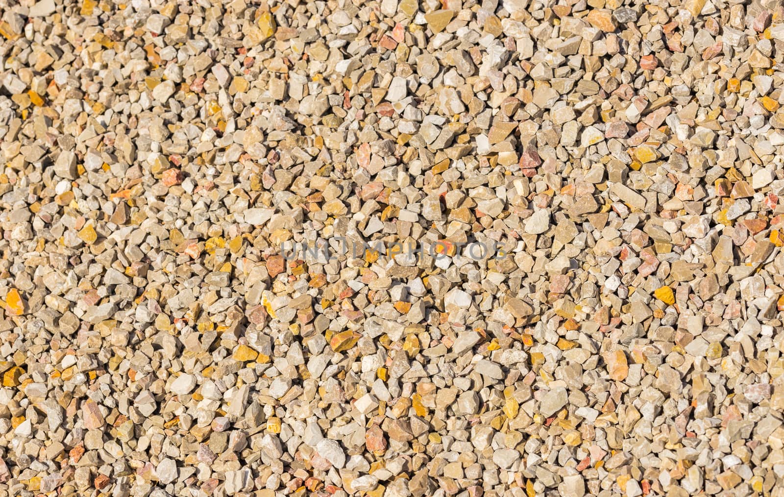 Close-up of small fine gray gravel background texture