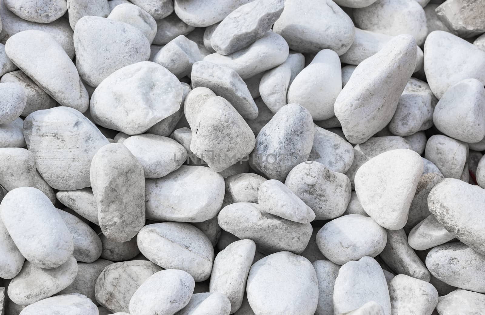 Close-up of white pepples stones background texture