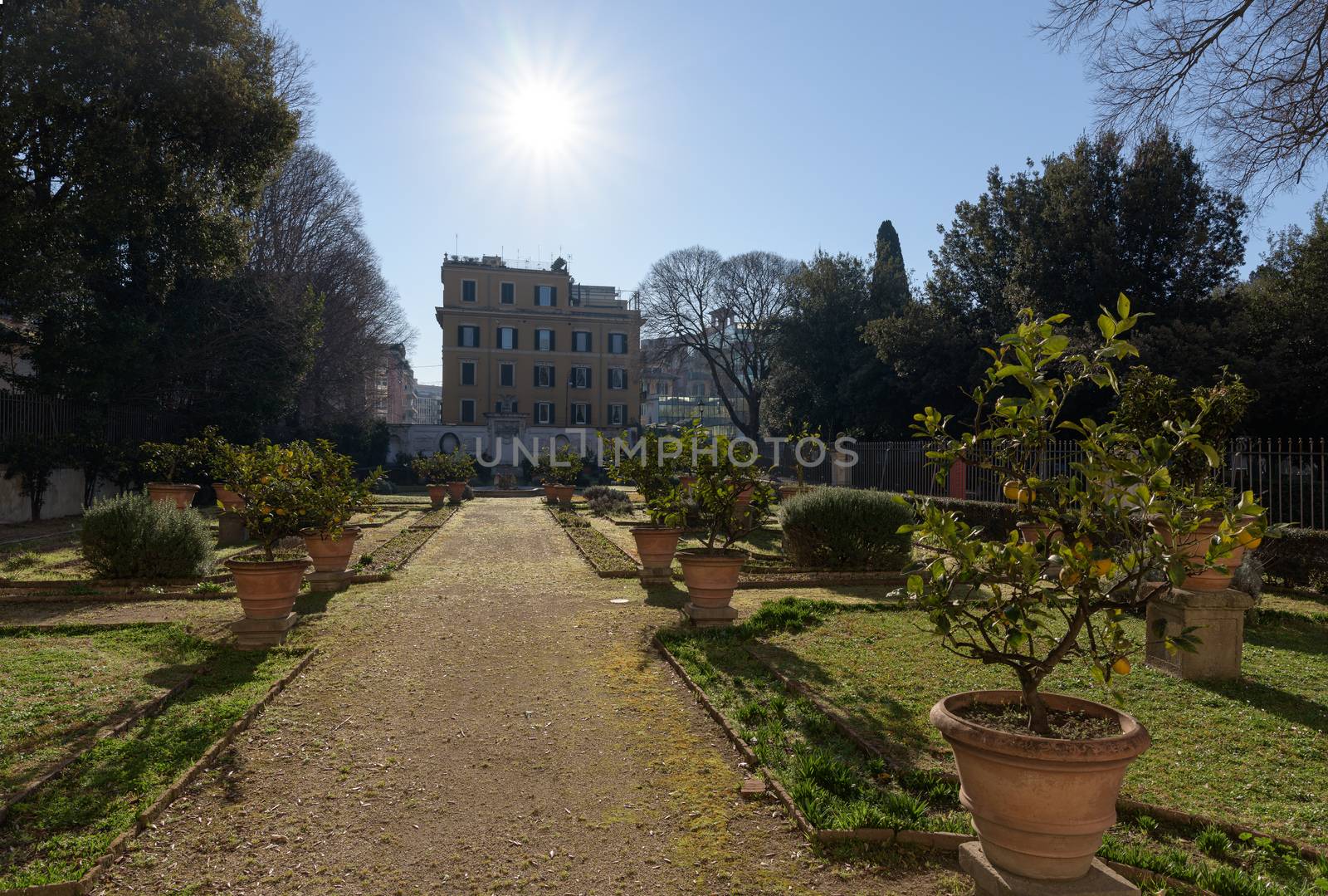 Rome, Italy - 16 Feb 2020: French gardens and elevation of the Casino Borghese, a Renaissance period rural palace, now a museum in central Villa Borghese park in Rome, Italy