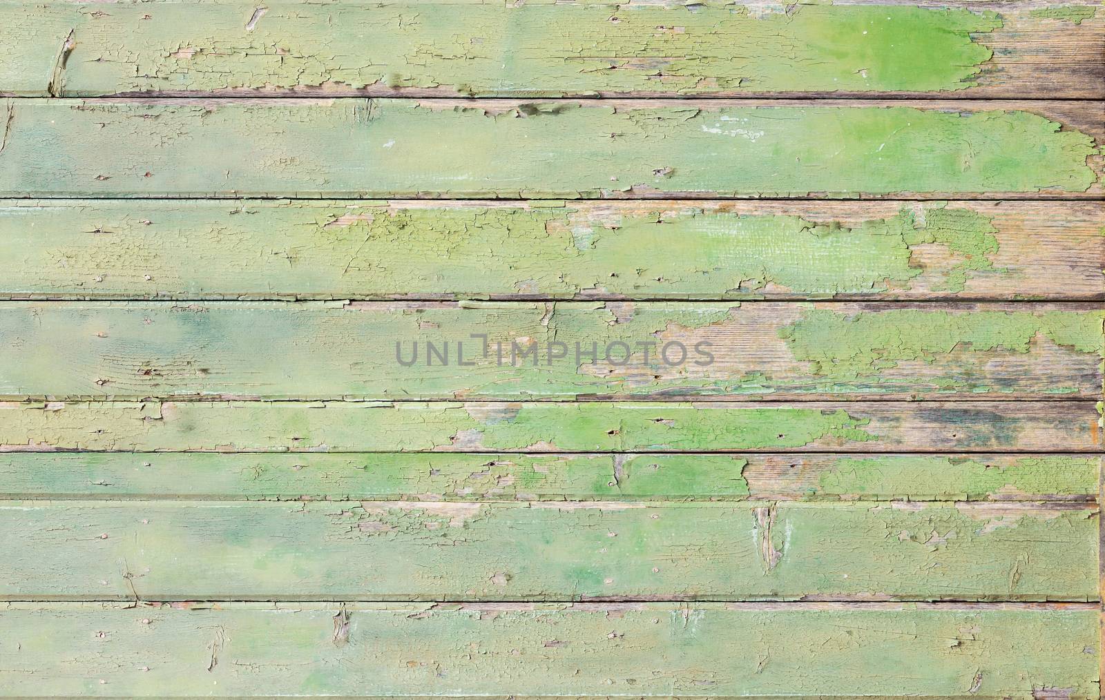 Rustic old green colored wooden planks background texture