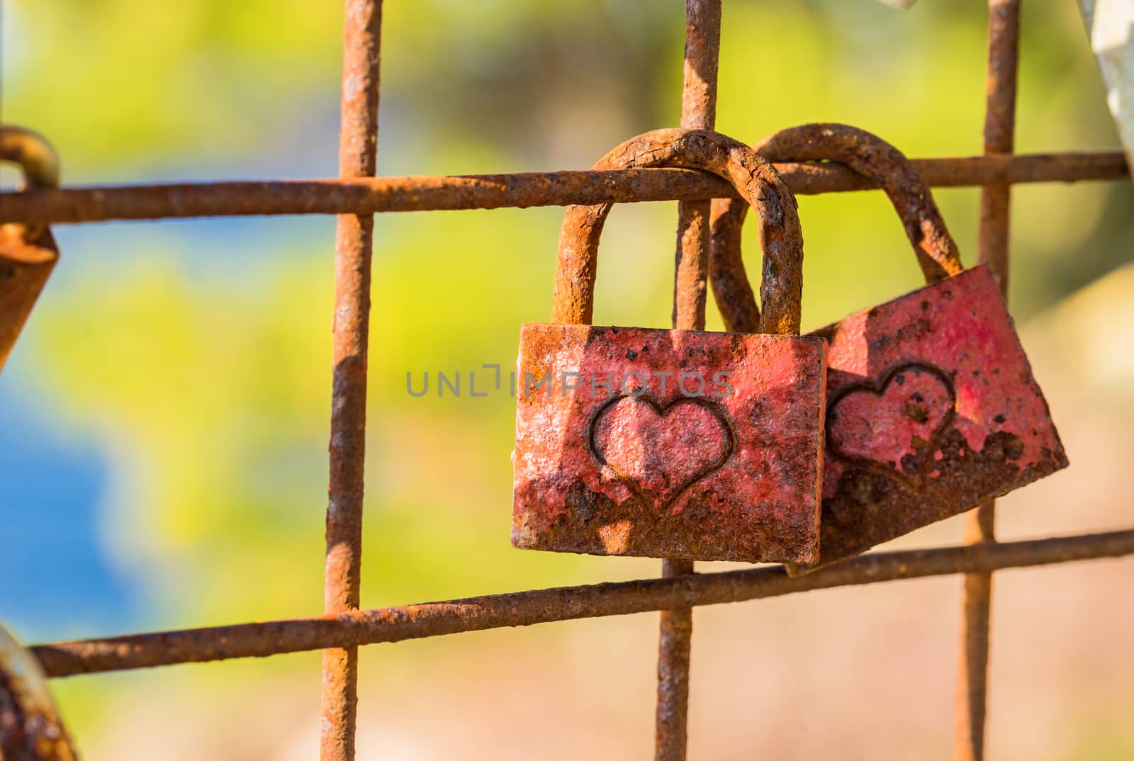 Two red love padlocks with heart engraving as romantic symbol for love