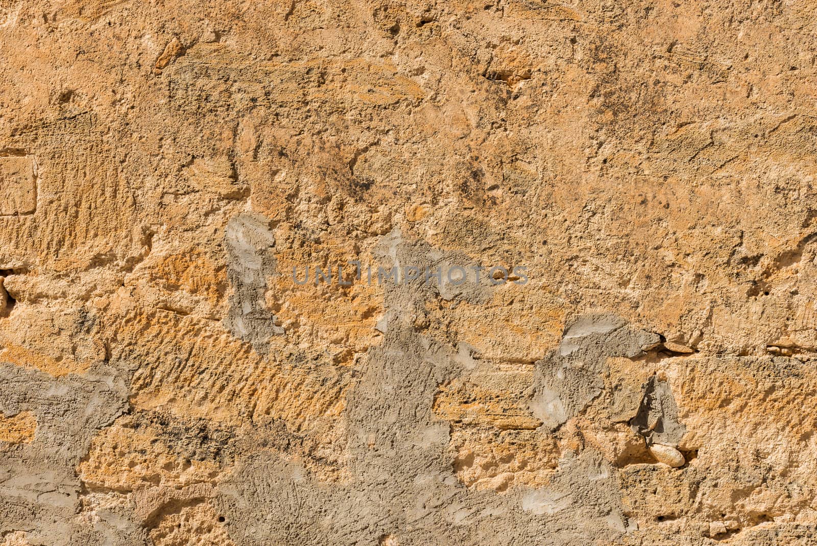 Old grunge damaged stone wall background texture, close-up