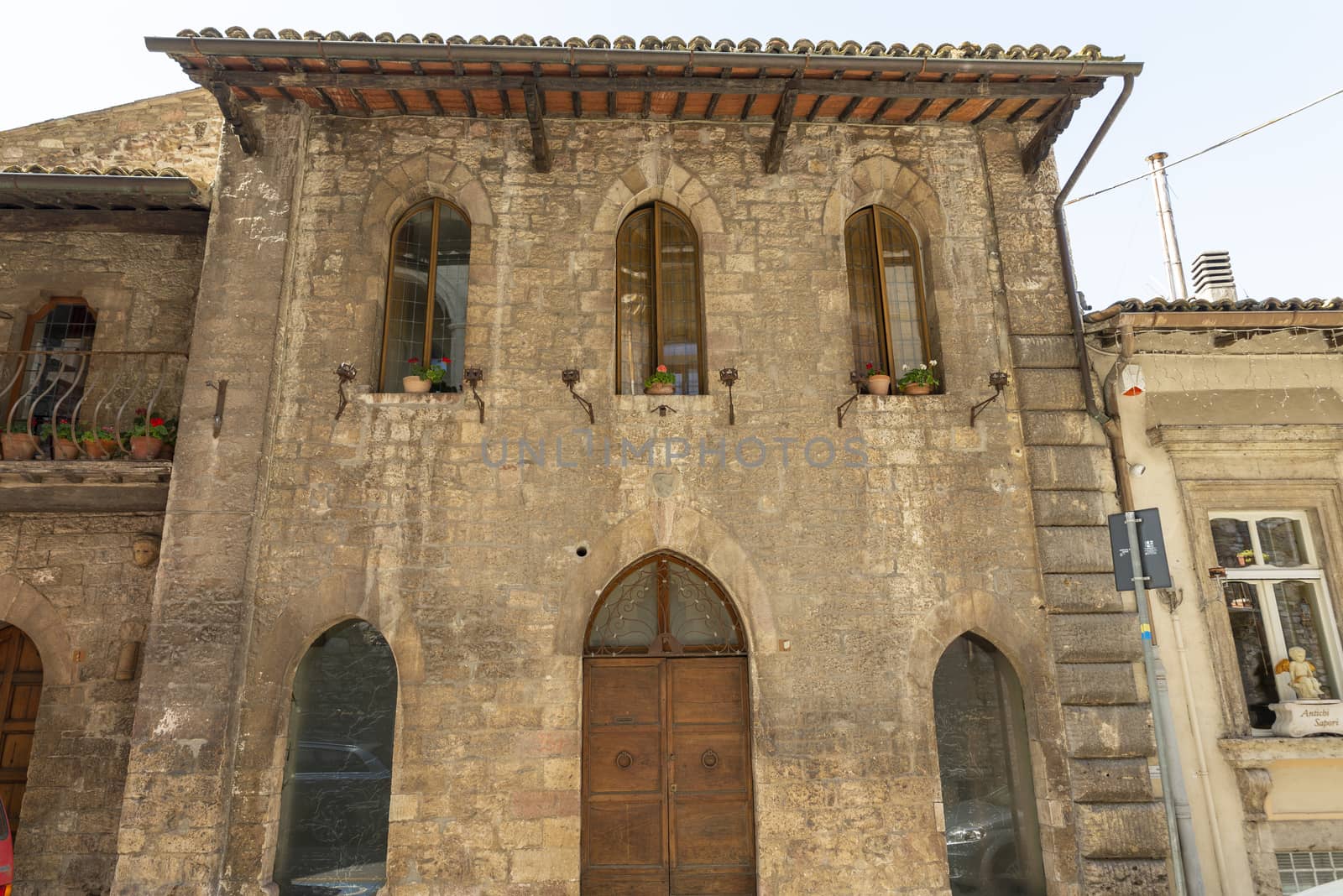 assisi,italy july 11 2020 :architecture of streets and buildings in the historic center of assisi
