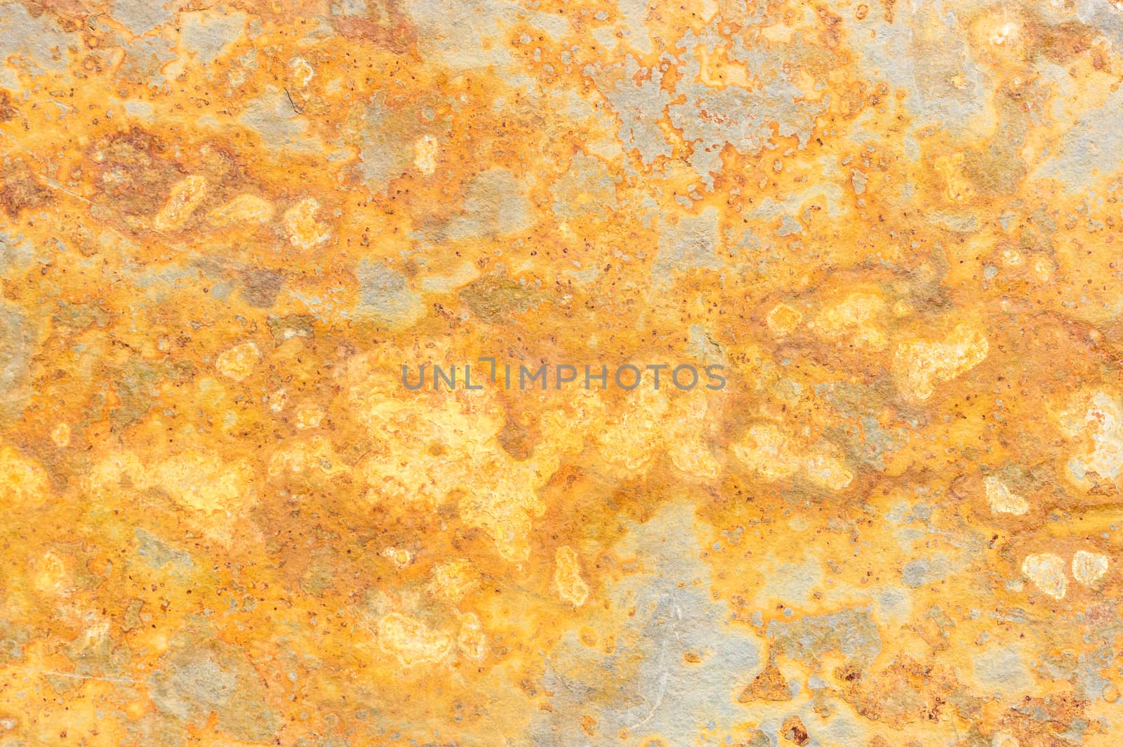 Slate mineral stone background stained golden colored