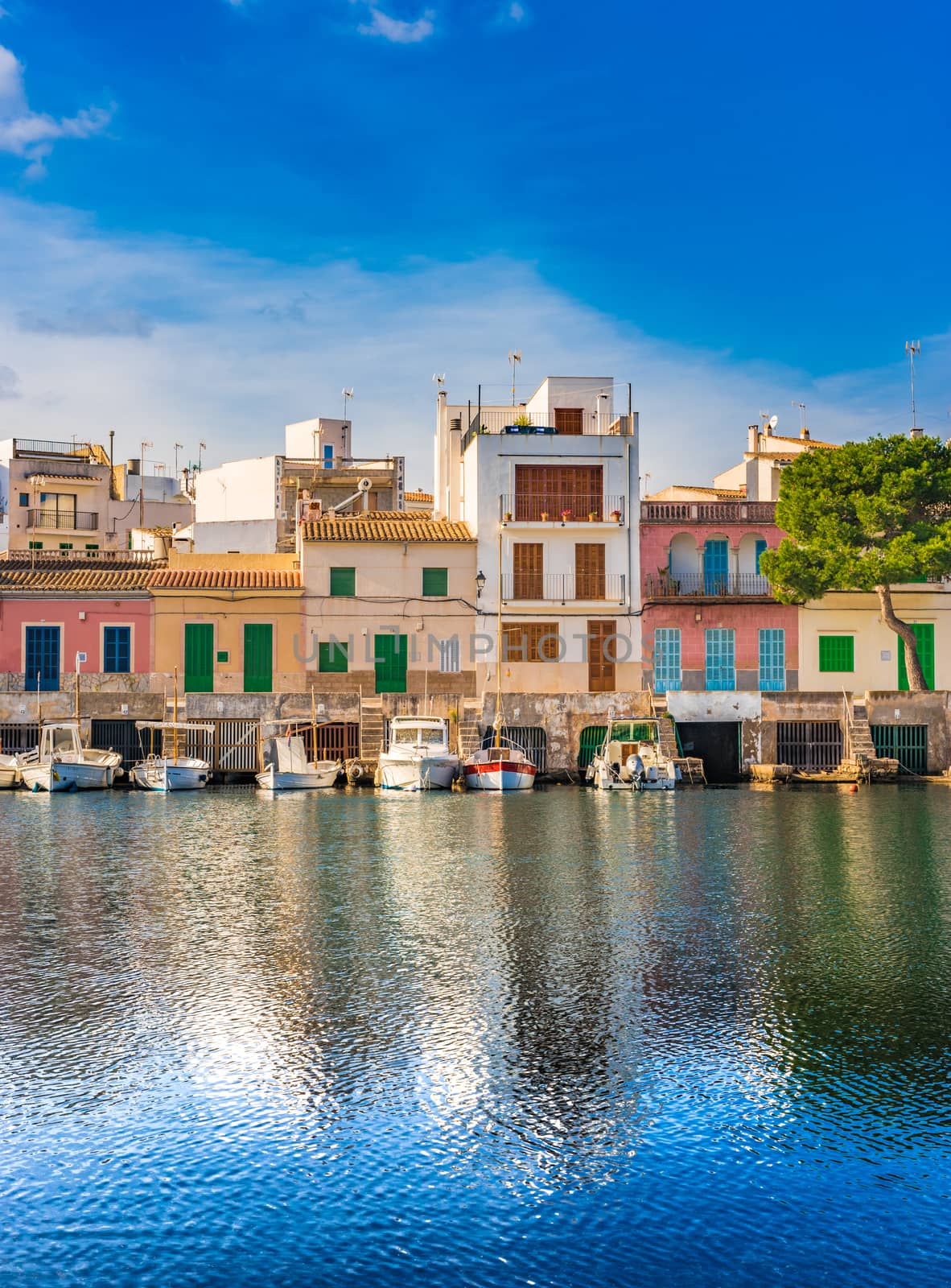 Colorful buildings at the harbor of Porto Colom, Majorca Spain by Vulcano