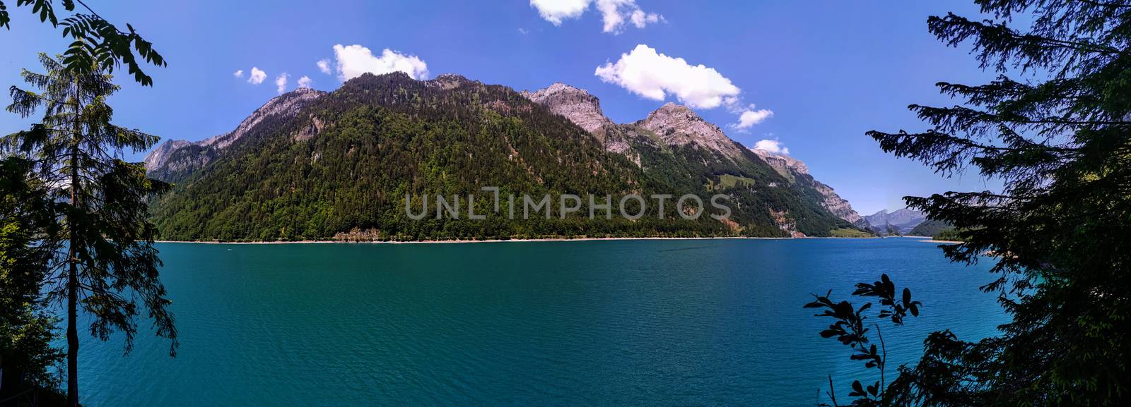 Swiss mountains and Lake. Scenic Alps and lane view. Trekking and outdoor lifestyle