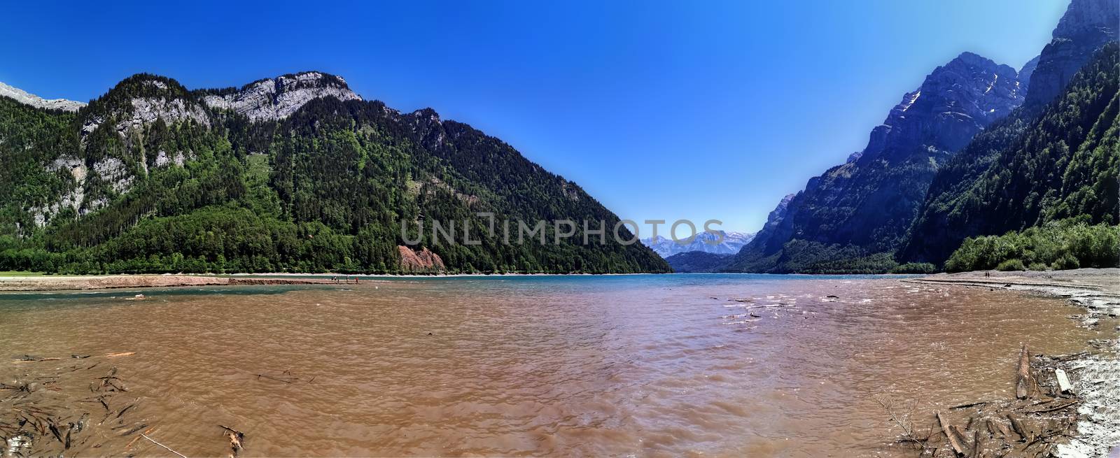 Swiss mountains and Lake. Scenic Alps and lane view. Trekking and outdoor lifestyle