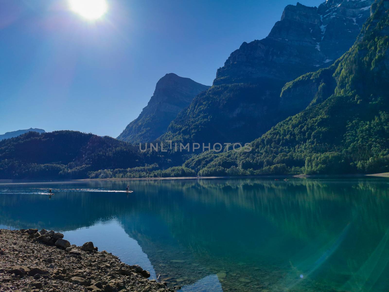 Swiss mountains and Lake. Scenic Alps and lane view. Trekking and outdoor lifestyle